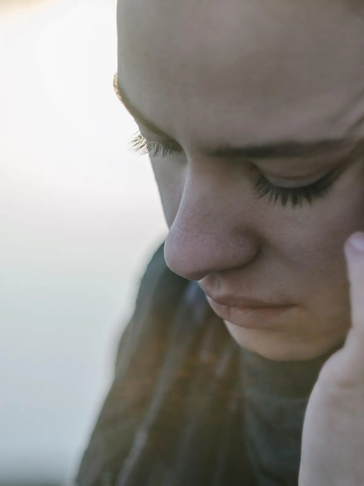 Young woman with sinus pressure pain. Depressing state concept