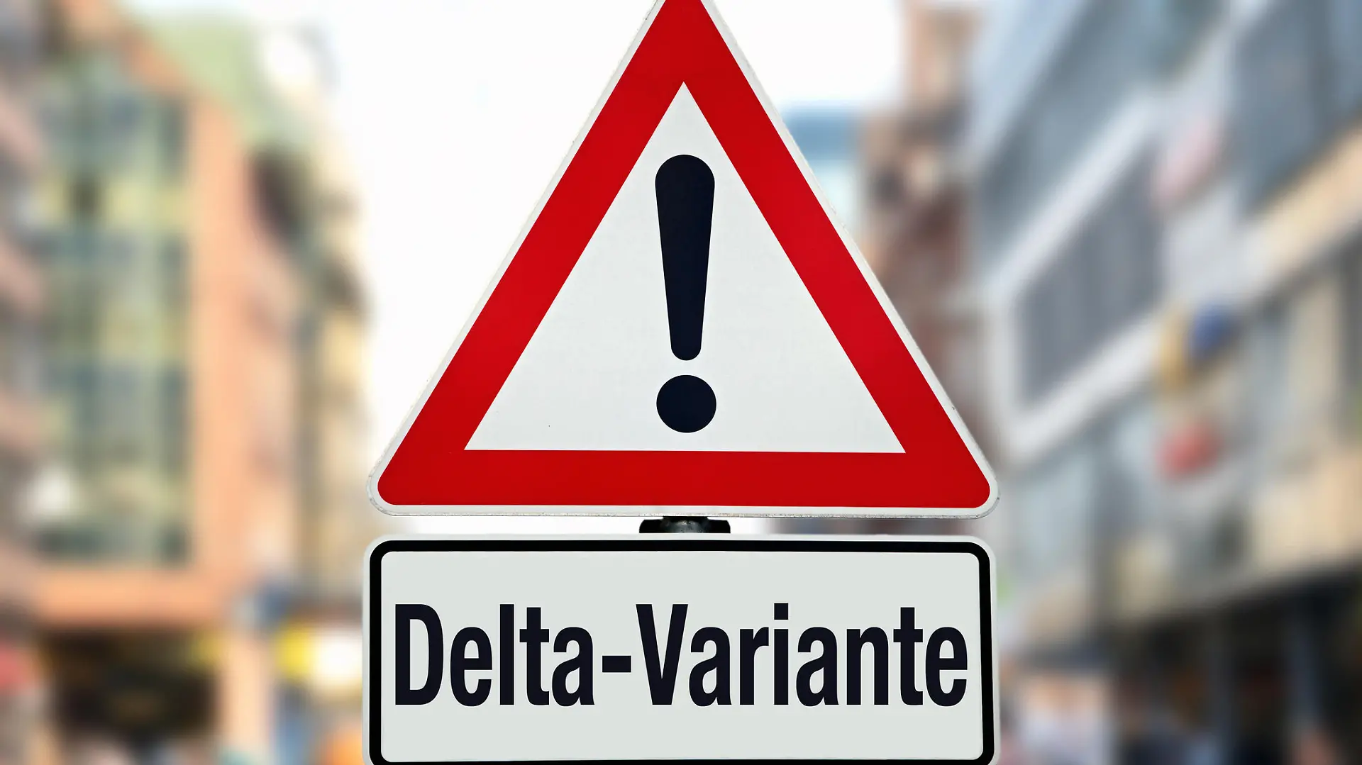 Ein Hinweisschild mit der Aufschrift "Delta-Variante"