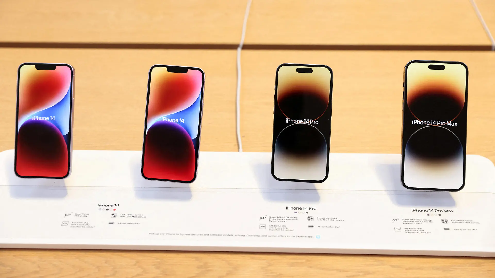 FILE PHOTO: The Apple iPhone 14, The Apple iPhone 14 Pro and the Apple iPhone 14 Pro Max are seen at the Apple Fifth Avenue store in Manhattan, New York City, U.S., September 16, 2022.  REUTERS/Andrew Kelly/File Photo