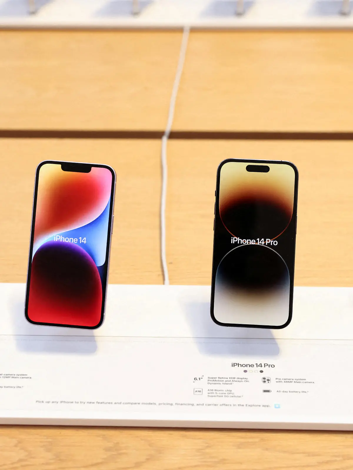 FILE PHOTO: The Apple iPhone 14, The Apple iPhone 14 Pro and the Apple iPhone 14 Pro Max are seen at the Apple Fifth Avenue store in Manhattan, New York City, U.S., September 16, 2022.  REUTERS/Andrew Kelly/File Photo