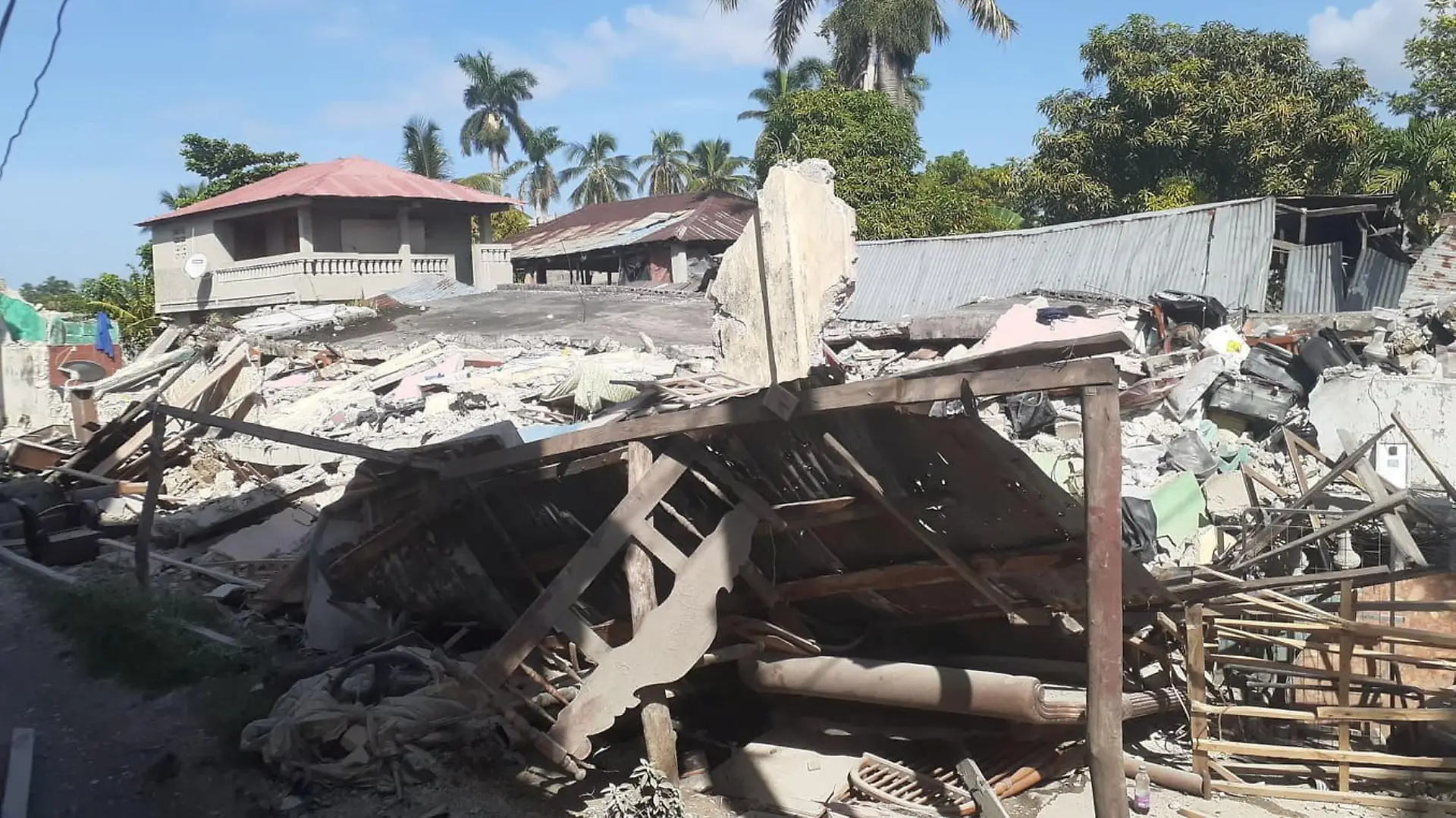 Damage is seen in an area after a major earthquake struck southwestern Haiti, in Les Cayes, Haiti August 14, 2021. Courtesy of Jose Flecher / Social Media via REUTERS ATTENTION EDITORS - THIS IMAGE HAS BEEN SUPPLIED BY A THIRD PARTY. NO RESALES. NO ARCHIVE. MANDATORY CREDIT JOSE FLECHER.
