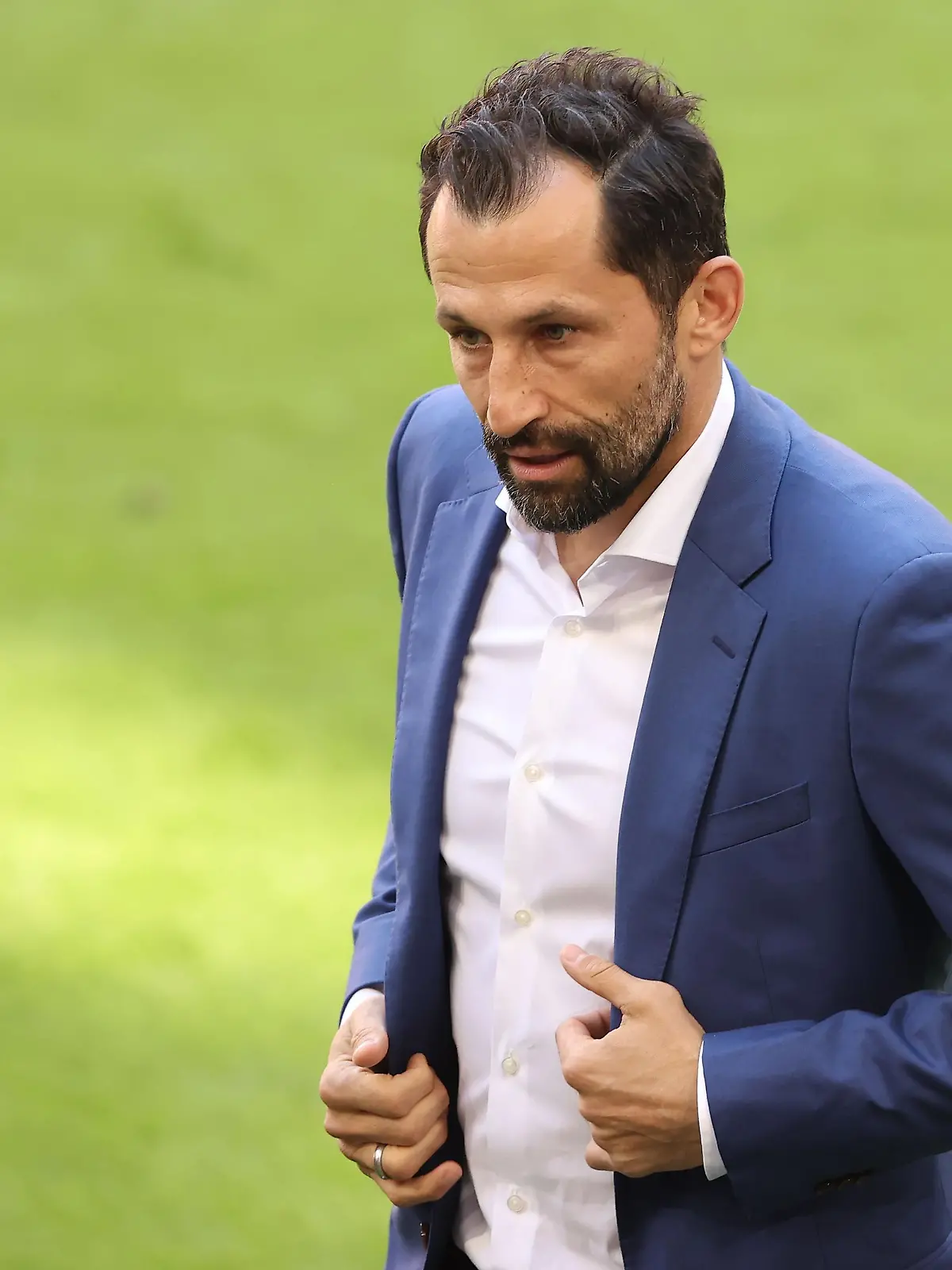 MUNICH, GERMANY - MAY 22: Hasan Salihamidzic, Sporting director 
 of FC Bayern München looks on prior to the Bundesliga match between FC Bayern Muenchen and FC Augsburg at Allianz Arena on May 22, 2021 in Munich, Germany. After the Bavarian cabinet decided on first relaxations for outdoor events, the current Corona situation allows FC Bayern to have its last match of the season in front of 250 spectators in the Allianz Arena. Of these, 100 tickets are given to people from the health sector selected by the Ministry of Health. (Photo by Alexander Hassenstein/Getty Images)