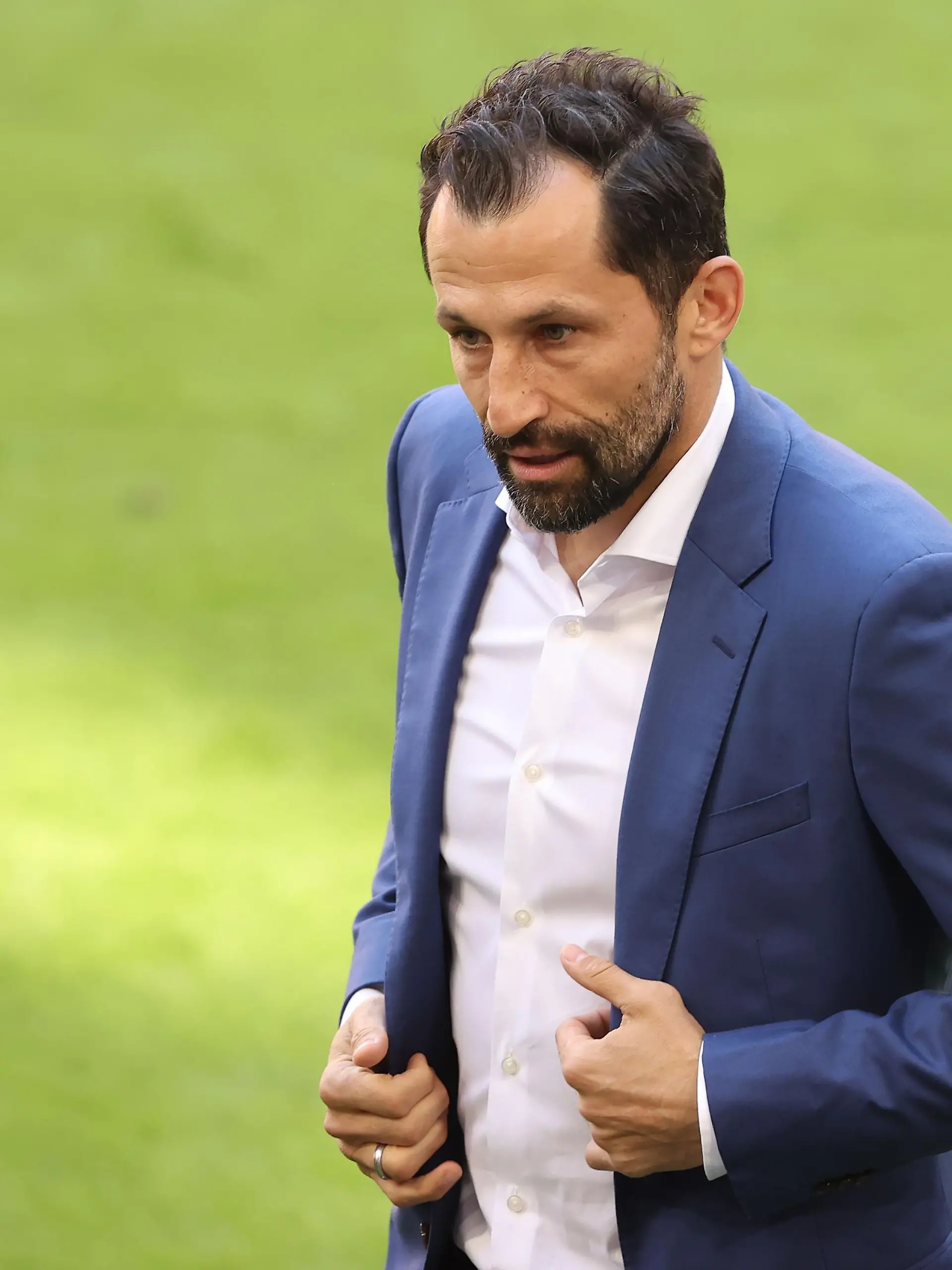 MUNICH, GERMANY - MAY 22: Hasan Salihamidzic, Sporting director 
 of FC Bayern München looks on prior to the Bundesliga match between FC Bayern Muenchen and FC Augsburg at Allianz Arena on May 22, 2021 in Munich, Germany. After the Bavarian cabinet decided on first relaxations for outdoor events, the current Corona situation allows FC Bayern to have its last match of the season in front of 250 spectators in the Allianz Arena. Of these, 100 tickets are given to people from the health sector selected by the Ministry of Health. (Photo by Alexander Hassenstein/Getty Images)