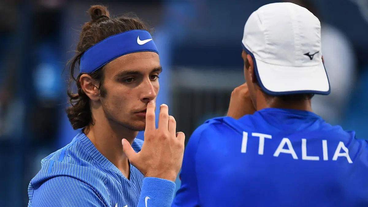 Tokyo 2020 Olympics - Tennis - Men's Doubles - Round 1 - Ariake Tennis Park - Tokyo, Japan - July 25, 2021. Lorenzo Musetti of Italy and Lorenzo Sonego of Italy react during their first round match against Pablo Andujar of Spain and Roberto Carballes of Spain REUTERS/Piroschka Van De Wouw