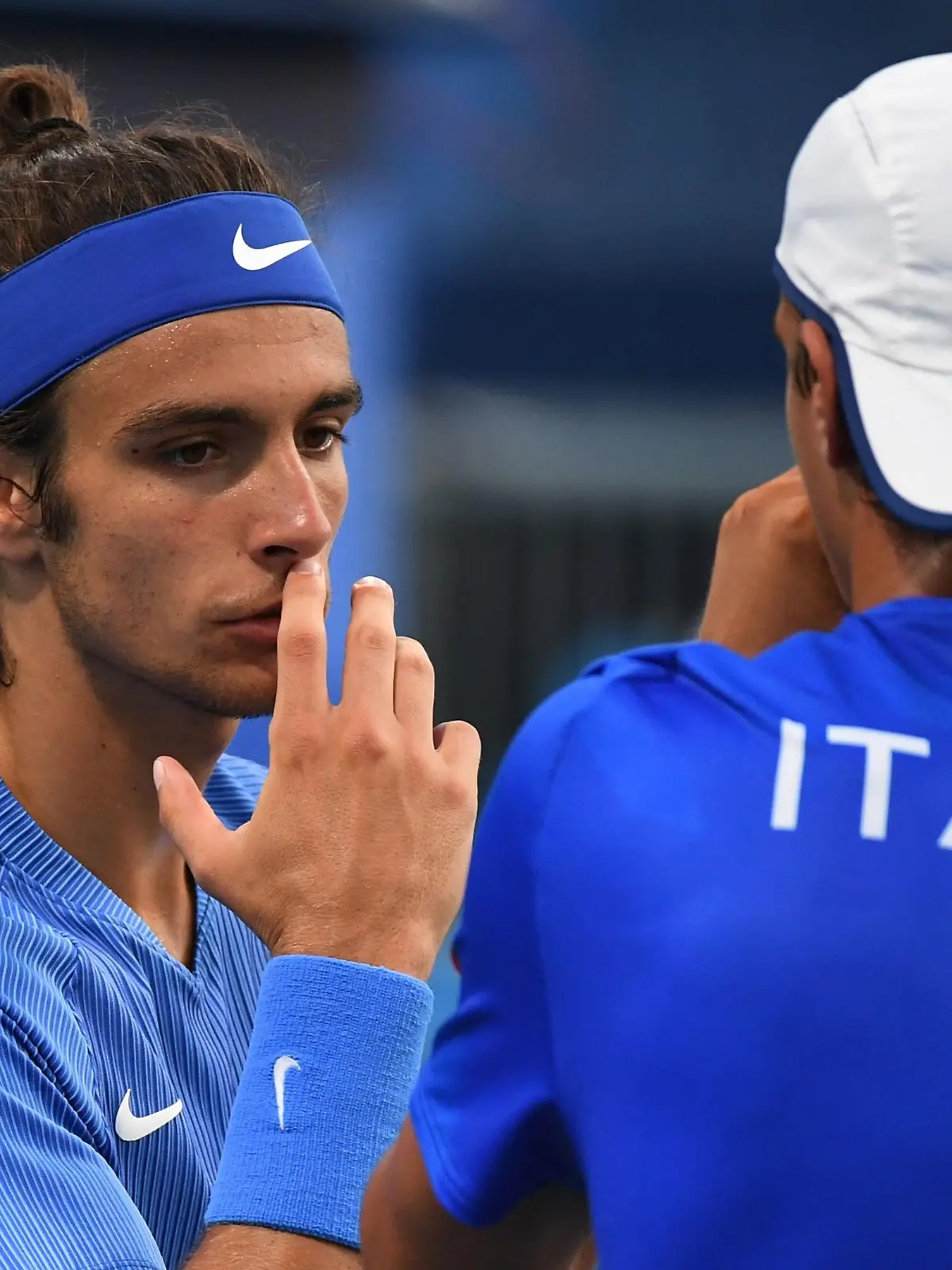 Tokyo 2020 Olympics - Tennis - Men's Doubles - Round 1 - Ariake Tennis Park - Tokyo, Japan - July 25, 2021. Lorenzo Musetti of Italy and Lorenzo Sonego of Italy react during their first round match against Pablo Andujar of Spain and Roberto Carballes of Spain REUTERS/Piroschka Van De Wouw