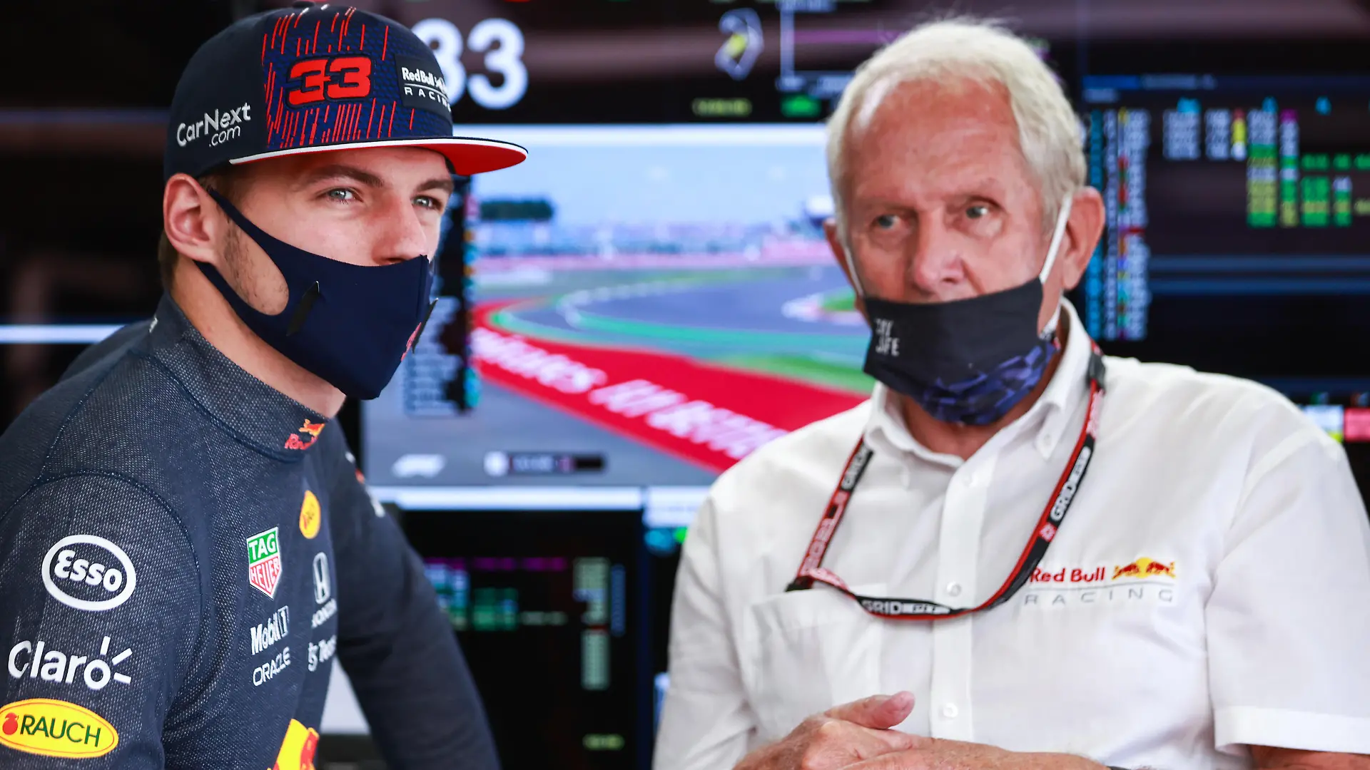 NORTHAMPTON, ENGLAND - JULY 17: Max Verstappen of Netherlands and Red Bull Racing and Red Bull Racing Team Consultant Dr Helmut Marko look on in the garage during practice ahead of the F1 Grand Prix of Great Britain at Silverstone on July 17, 2021 in Northampton, England. (Photo by Mark Thompson/Getty Images)