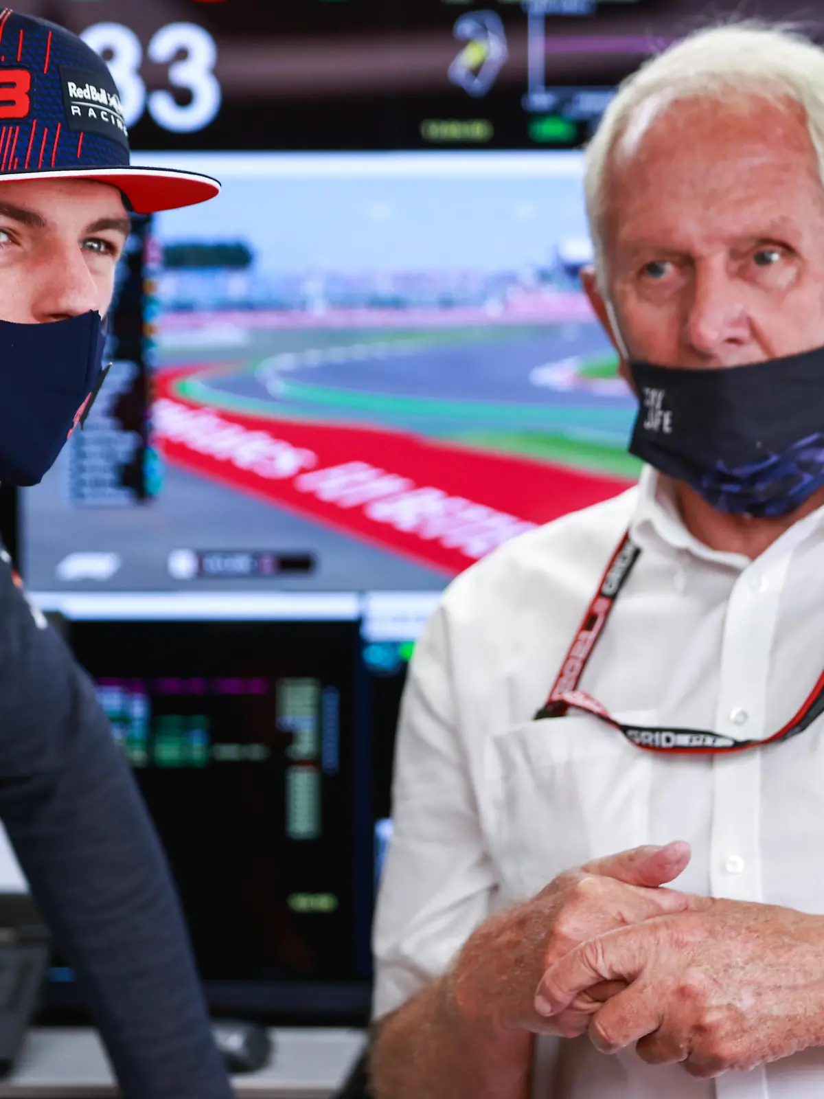 NORTHAMPTON, ENGLAND - JULY 17: Max Verstappen of Netherlands and Red Bull Racing and Red Bull Racing Team Consultant Dr Helmut Marko look on in the garage during practice ahead of the F1 Grand Prix of Great Britain at Silverstone on July 17, 2021 in Northampton, England. (Photo by Mark Thompson/Getty Images)