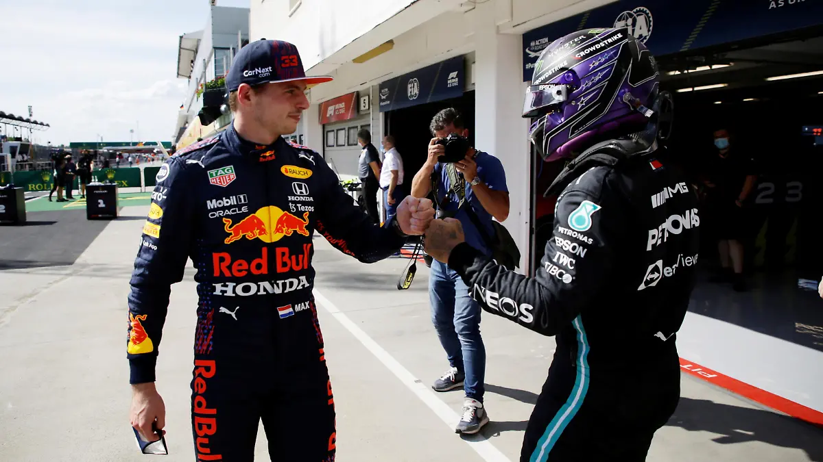 Formula One F1 - Hungarian Grand Prix - Hungaroring, Budapest, Hungary - July 31, 2021  Mercedes' Lewis Hamilton bumps fists with Red Bull's Max Verstappen after qualifying in pole position and third place respectively  Pool via REUTERS/David W Cerny