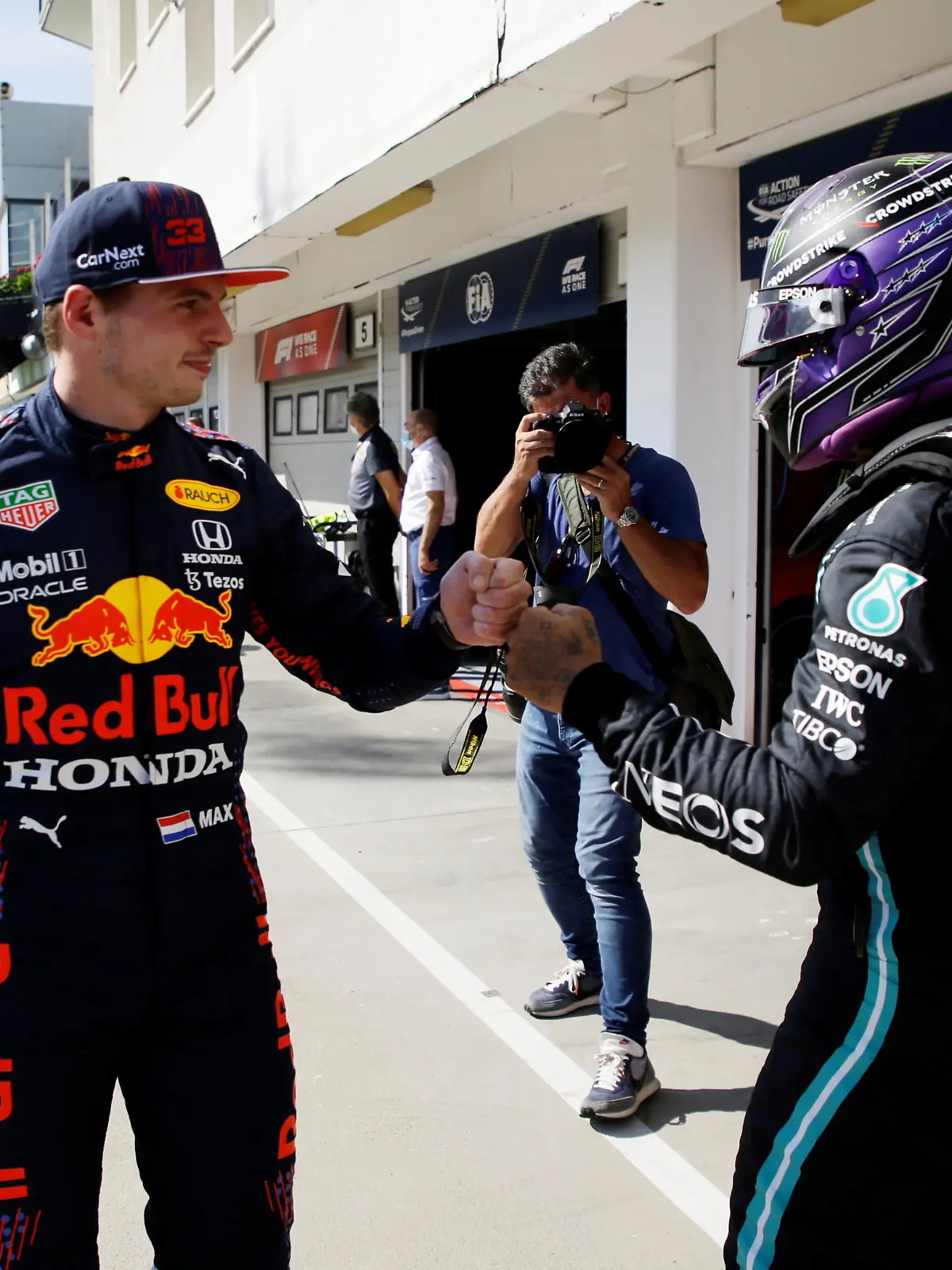 Formula One F1 - Hungarian Grand Prix - Hungaroring, Budapest, Hungary - July 31, 2021  Mercedes' Lewis Hamilton bumps fists with Red Bull's Max Verstappen after qualifying in pole position and third place respectively  Pool via REUTERS/David W Cerny