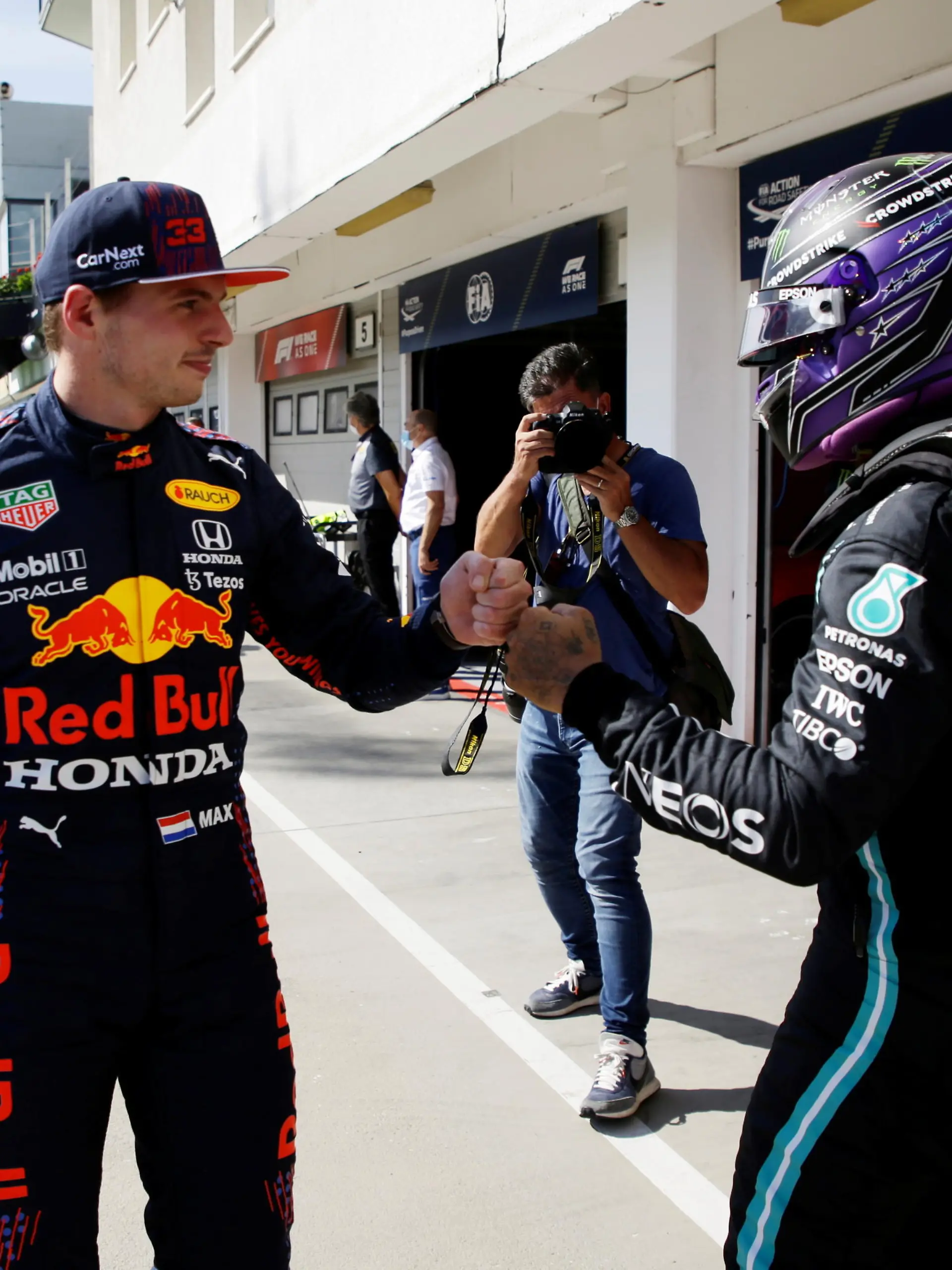 Formula One F1 - Hungarian Grand Prix - Hungaroring, Budapest, Hungary - July 31, 2021  Mercedes' Lewis Hamilton bumps fists with Red Bull's Max Verstappen after qualifying in pole position and third place respectively  Pool via REUTERS/David W Cerny