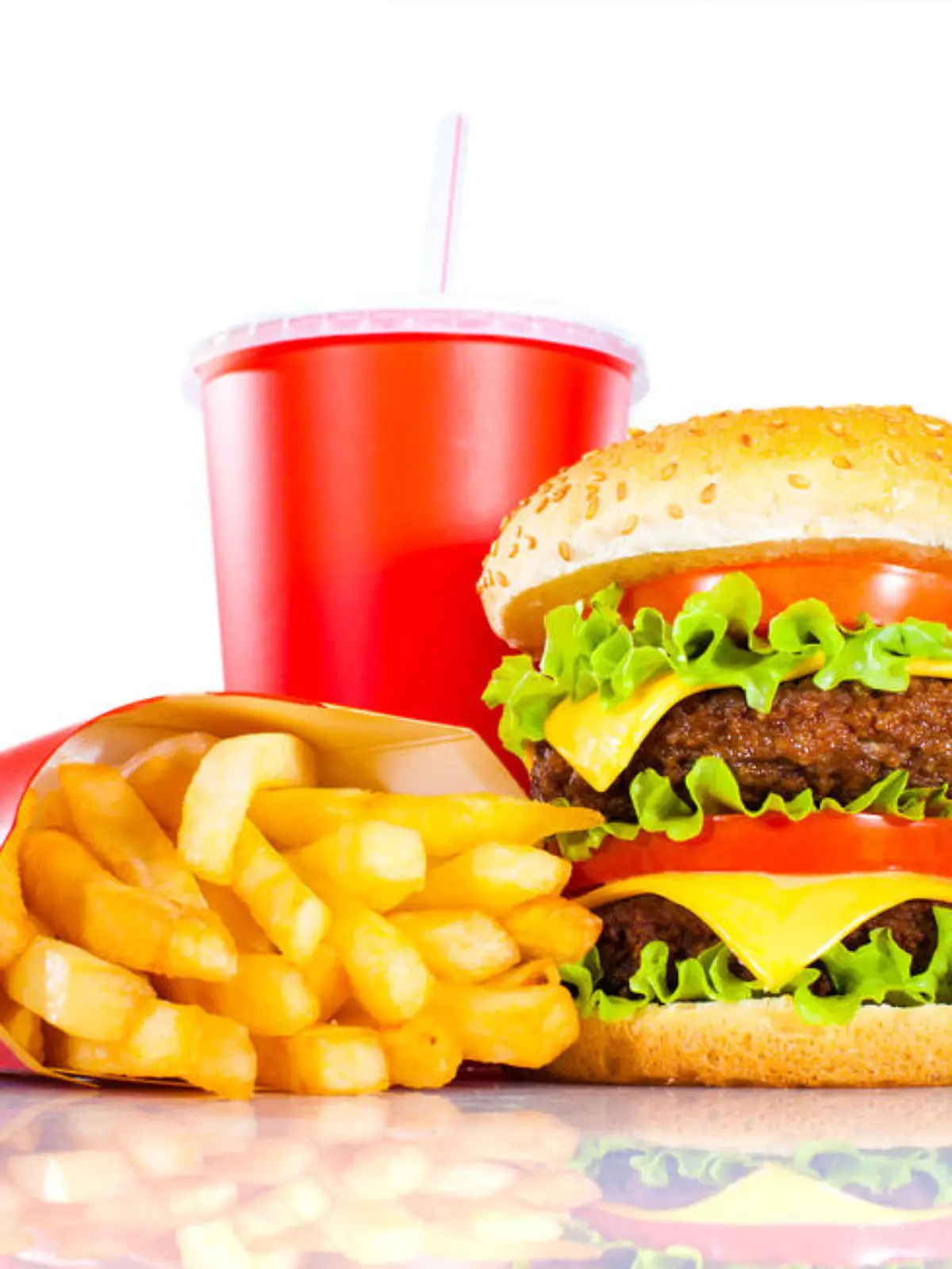 Tasty hamburger and french fries on a white background