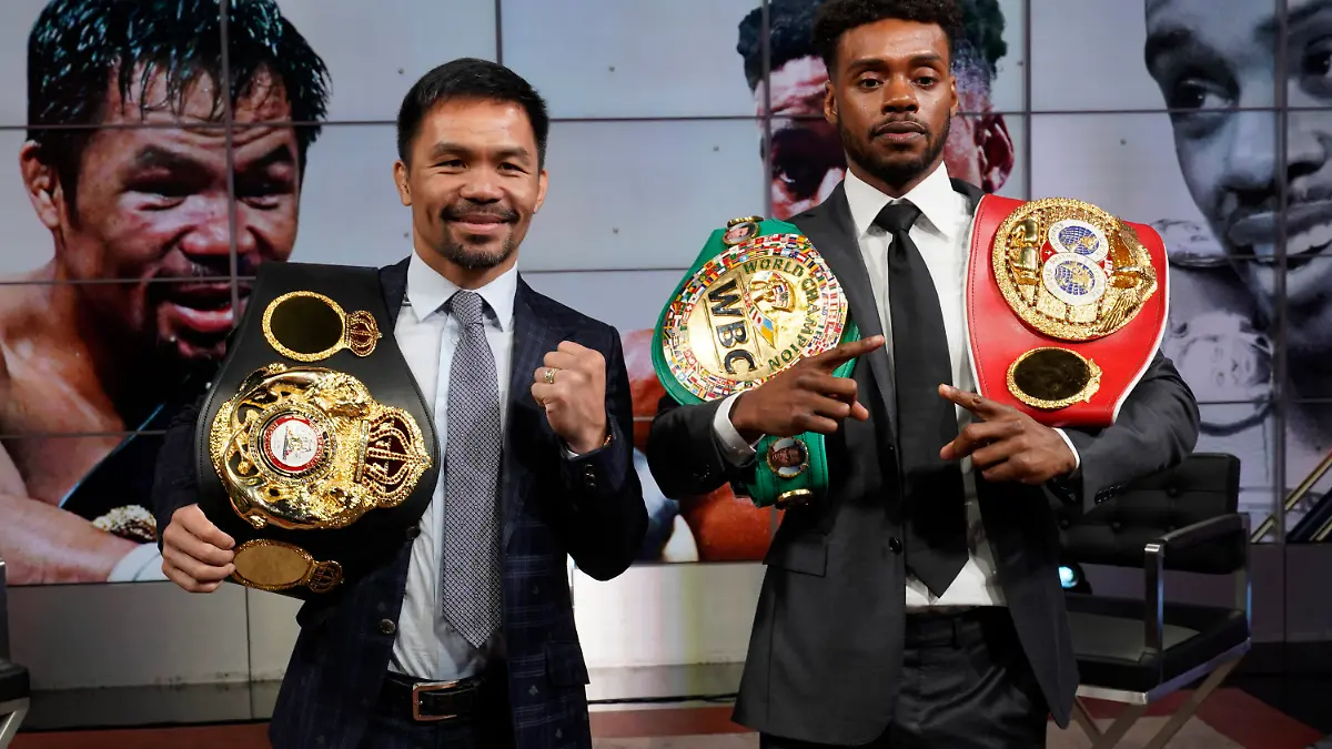 Manny Pacquiao, left, and Errol Spence Jr., pose for a photo at a news conference at the Fox Studios lot in Los Angeles ahead of their upcoming boxing match, taking place in Las Vegas on Aug. 21, in Los Angeles Sunday, July 11, 2021. (AP Photo/Damian Dovarganes)