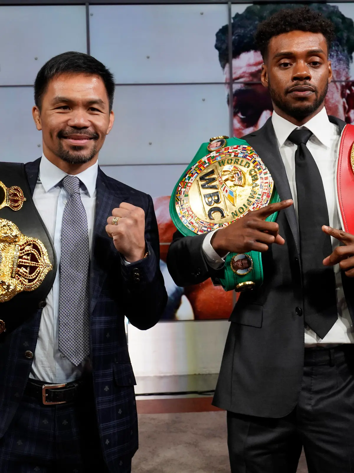 Manny Pacquiao, left, and Errol Spence Jr., pose for a photo at a news conference at the Fox Studios lot in Los Angeles ahead of their upcoming boxing match, taking place in Las Vegas on Aug. 21, in Los Angeles Sunday, July 11, 2021. (AP Photo/Damian Dovarganes)