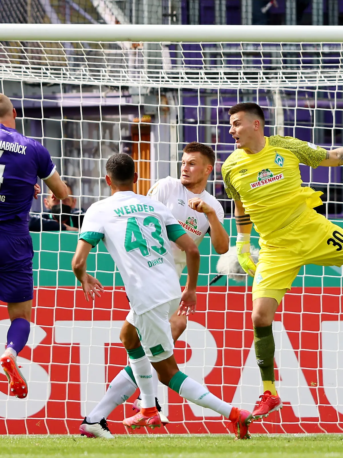 OSNABRUECK, GERMANY - AUGUST 07: Lukas Gugganig of Osnabrueck (2nd L) misses the firstn goal during the DFB Cup first round match between VfL Osnabrück and Werder Bremen at  on August 07, 2021 in Osnabrueck, Germany. (Photo by Christof Koepsel/Getty Images)