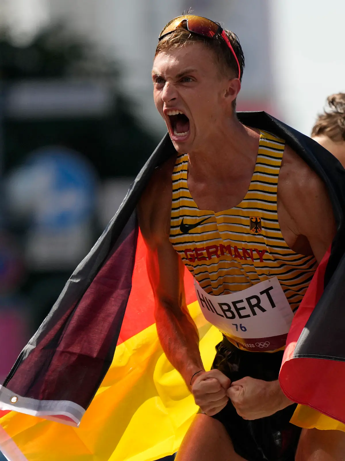 Jonathan Hilbert, of Germany, celebrates after placing second in the men's 50km race walk at the 2020 Summer Olympics, Friday, Aug. 6, 2021, in Sapporo, Japan. (AP Photo/Shuji Kajiyama)