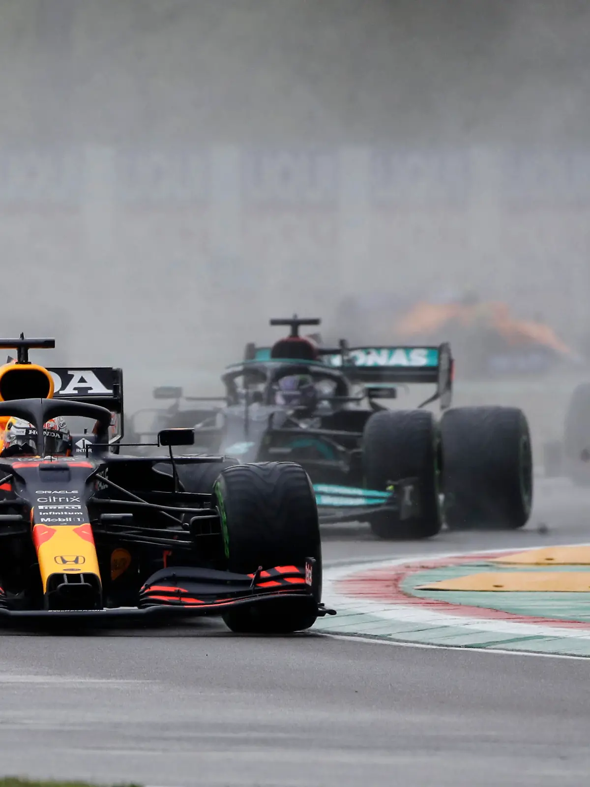 Red Bull driver Max Verstappen of the Netherlands leads Mercedes driver Lewis Hamilton of Britain and Ferrari driver Charles Leclerc of Monaco during the Emilia Romagna Formula One Grand Prix, at the Imola racetrack, Italy, Sunday, April 18, 2021. (AP Photo/Luca Bruno)