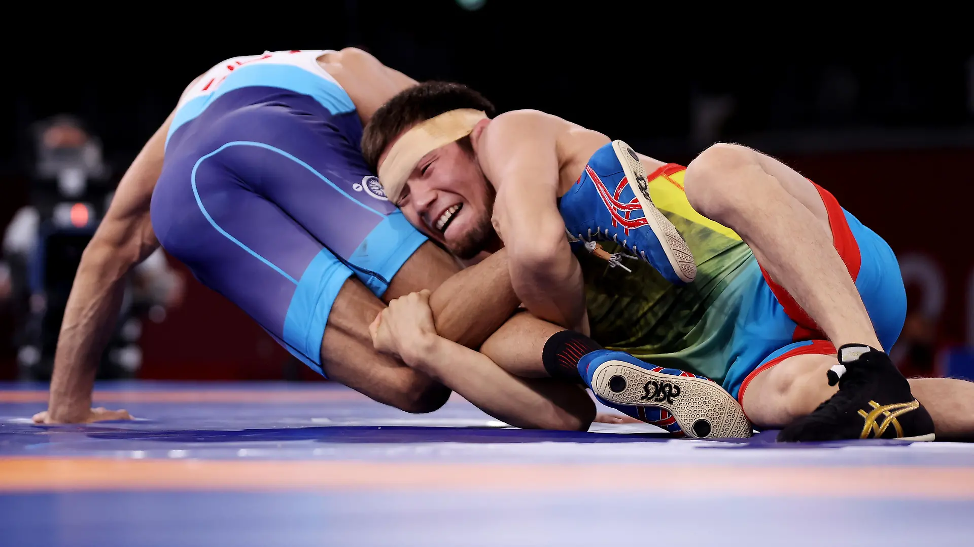 CHIBA, JAPAN - AUGUST 04:   Nurislam Sanayev of Team Kazakhstan competes against Kumar Ravi of Team India during the Men’s Freestyle 57kg Semi Final on day twelve of the Tokyo 2020 Olympic Games at Makuhari Messe Hall on August 04, 2021 in Chiba, Japan. (Photo by Maddie Meyer/Getty Images)