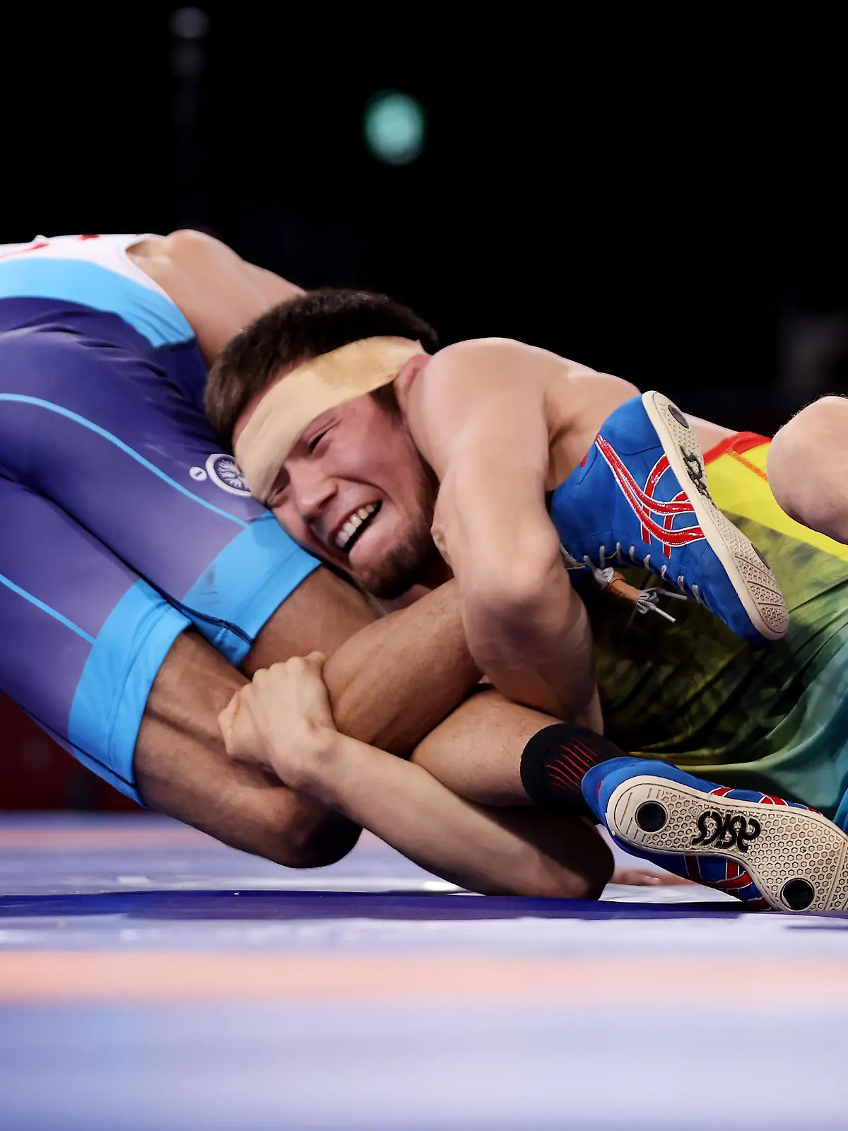 CHIBA, JAPAN - AUGUST 04:   Nurislam Sanayev of Team Kazakhstan competes against Kumar Ravi of Team India during the Men’s Freestyle 57kg Semi Final on day twelve of the Tokyo 2020 Olympic Games at Makuhari Messe Hall on August 04, 2021 in Chiba, Japan. (Photo by Maddie Meyer/Getty Images)