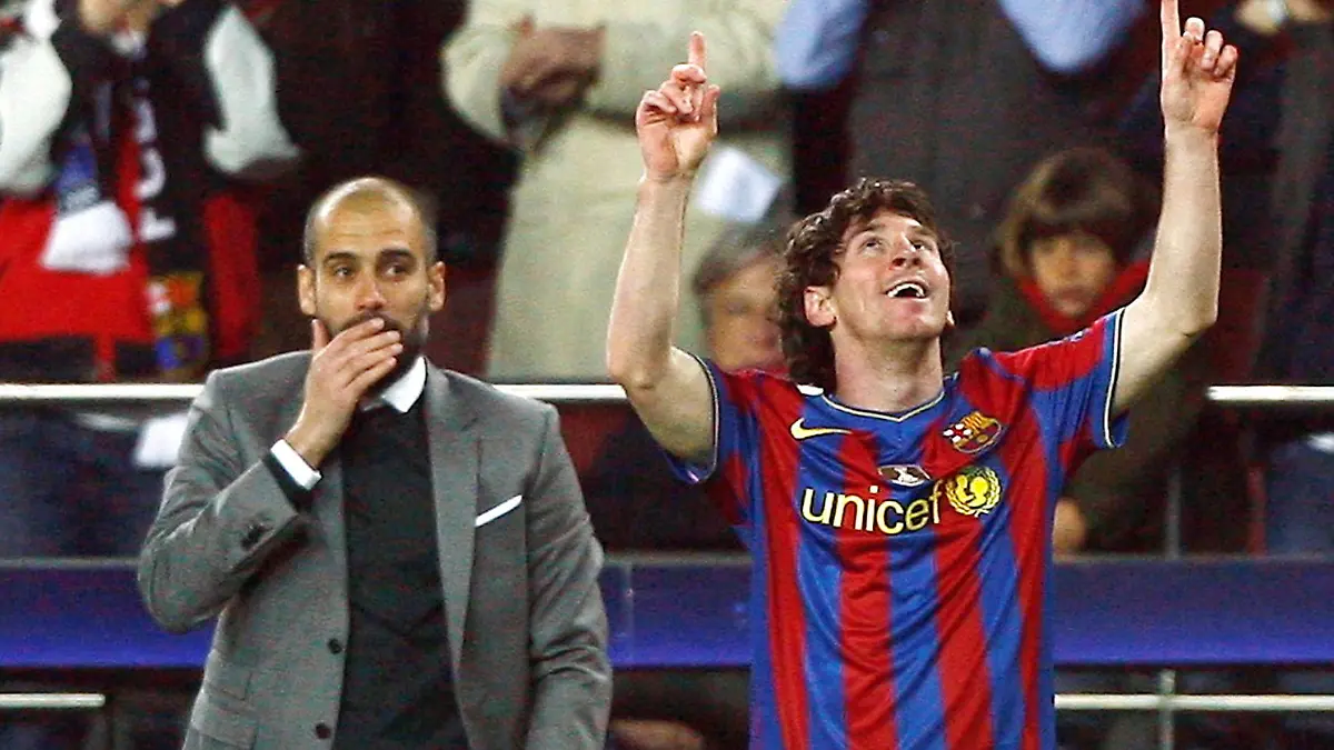 FILE PHOTO: Barcelona's Lionel Messi (R) celebrates in front of his coach Pep Guardiola after scoring a goal against VfB Stuttgart during their Champions League last 16, second leg soccer match at the Nou Camp stadium in Barcelona March 17, 2010. Picture taken March 17, 2010. REUTERS/Albert Gea/File Photo