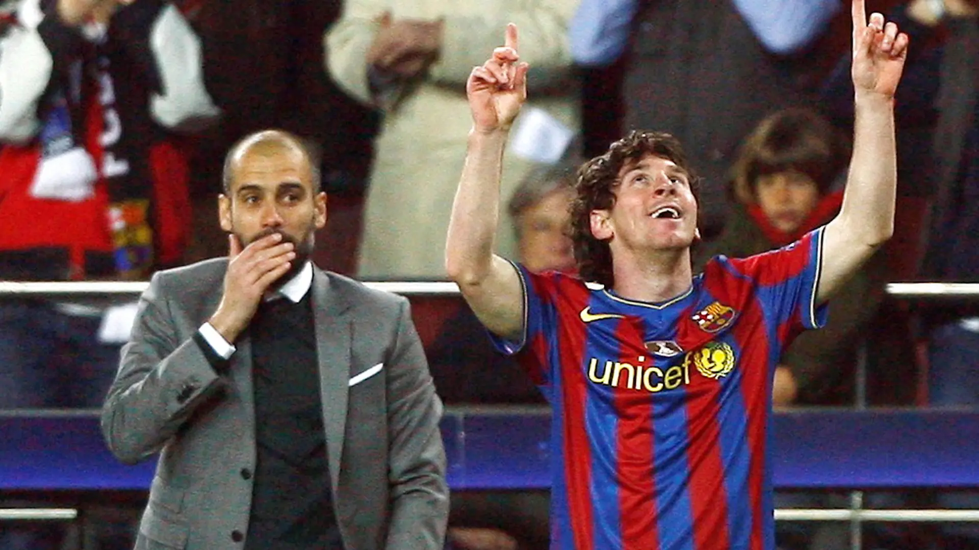 FILE PHOTO: Barcelona's Lionel Messi (R) celebrates in front of his coach Pep Guardiola after scoring a goal against VfB Stuttgart during their Champions League last 16, second leg soccer match at the Nou Camp stadium in Barcelona March 17, 2010. Picture taken March 17, 2010.  REUTERS/Albert Gea/File Photo