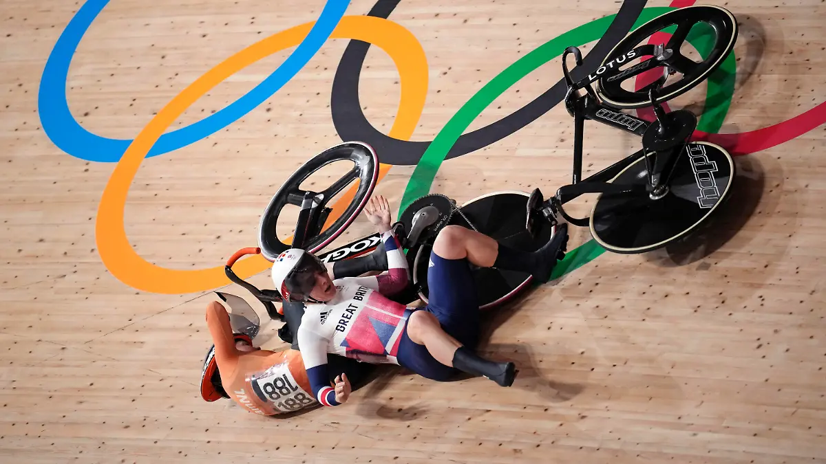 Katy Marchant of Team Great Britain crashes with Laurine van Riessen of Team Netherlands (188) during the track cycling women keirin at the 2020 Summer Olympics, Thursday, Aug. 5, 2021, in Izu, Japan. (AP Photo/Christophe Ena)