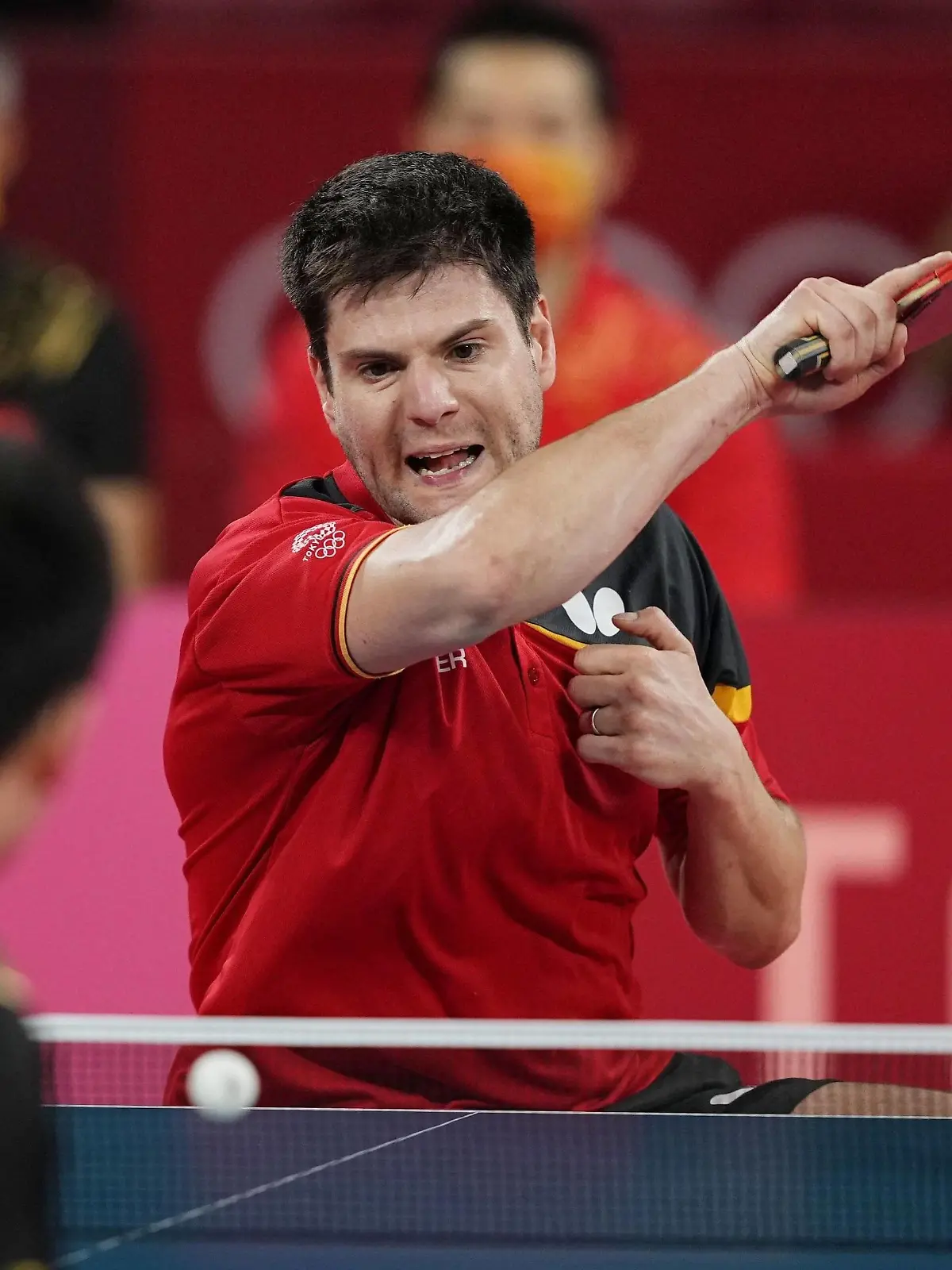 Tokyo Olympics: Table tennis, Tischtennis Germany s Dimitrij Ovtcharov facing camera plays against China s Fan Zhendong in the second match of the men s table tennis team event s gold medal contest at the Tokyo Olympics on Aug. 6, 2021, at Tokyo Metropolitan Gymnasium. PUBLICATIONxINxGERxSUIxAUTxHUNxONLY A14AA0000756892P 