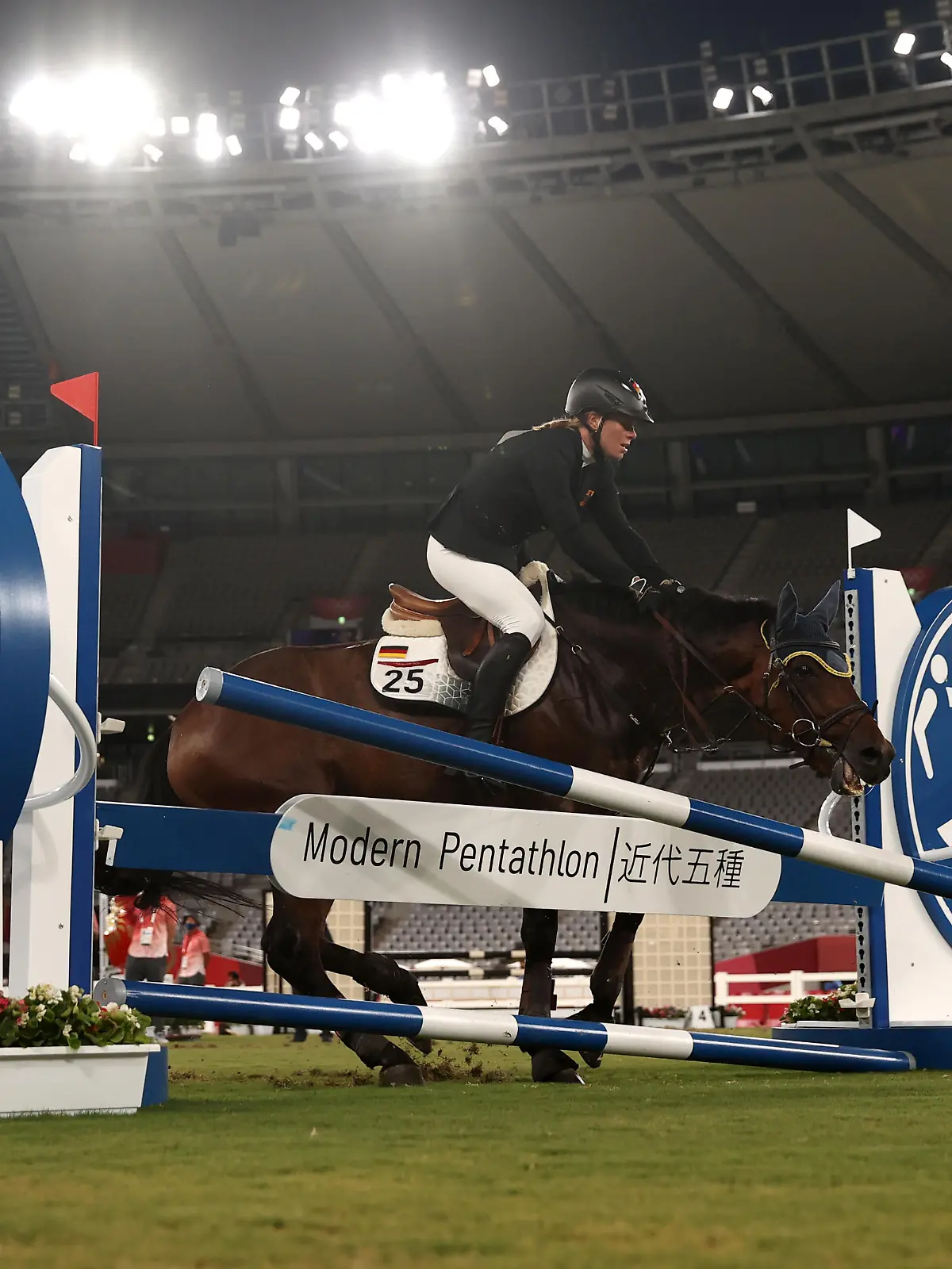 CHOFU, JAPAN - AUGUST 06: Annika Schleu of Team Germany fails a jump during the Riding Show Jumping of the Women's Modern Pentathlon on day fourteen of the Tokyo 2020 Olympic Games at Tokyo Stadium on August 06, 2021 in Chofu, Japan. (Photo by Dan Mullan/Getty Images)