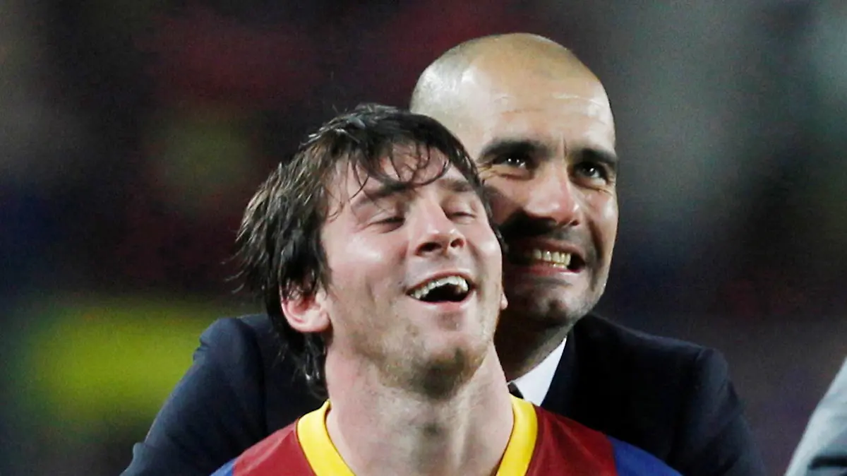 FILE PHOTO: Soccer Football - FC Barcelona v Real Madrid - UEFA Champions League Semi Final Second Leg - The Nou Camp, Barcelona, Spain -May 3, 2021 Barcelona coach Josep Guardiola celebrates at the end of the match with Lionel Messi Action Images via Reuters/Lee Smith/File Photo