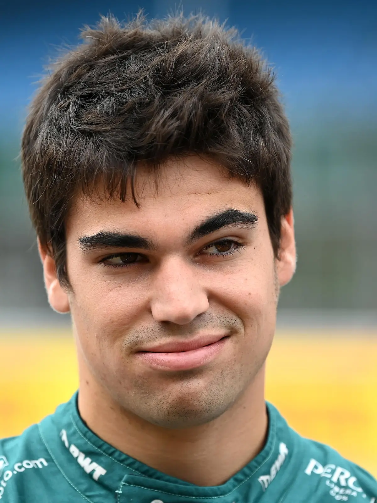NORTHAMPTON, ENGLAND - JULY 15: Lance Stroll of Canada and Aston Martin F1 Team looks on as the prototype for the 2022 F1 season is unveiled during previews ahead of the F1 Grand Prix of Great Britain at Silverstone on July 15, 2021 in Northampton, England. (Photo by Michael Regan/Getty Images)