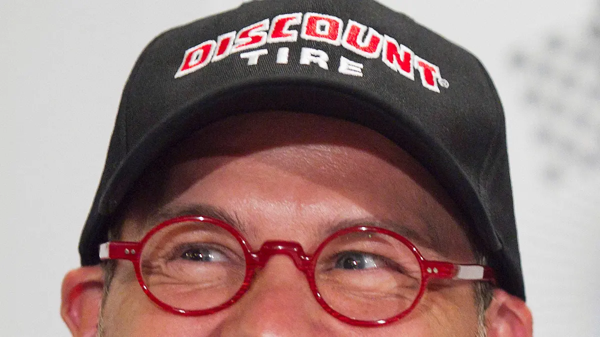 FILE PHOTO: Canadian race car driver Jacques Villeneuve smiles as he speaks to the media prior to the NAPA Auto Parts 200 Nationwide Series NASCAR race in Montreal, August 18, 2011. REUTERS/Christinne Muschi/File Photo