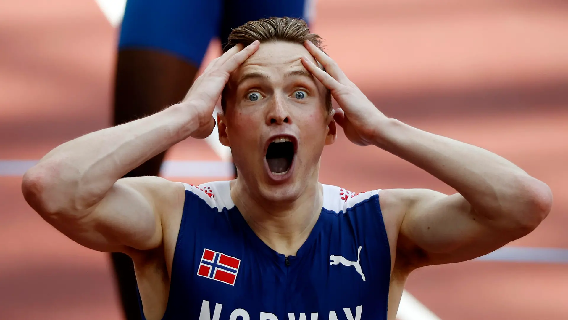 Tokyo 2020 Olympics - Athletics - Men's 400m Hurdles - Final - Olympic Stadium, Tokyo, Japan - August 3, 2021. Karsten Warholm of Norway celebrates after winning gold and setting a new world record REUTERS/Phil Noble