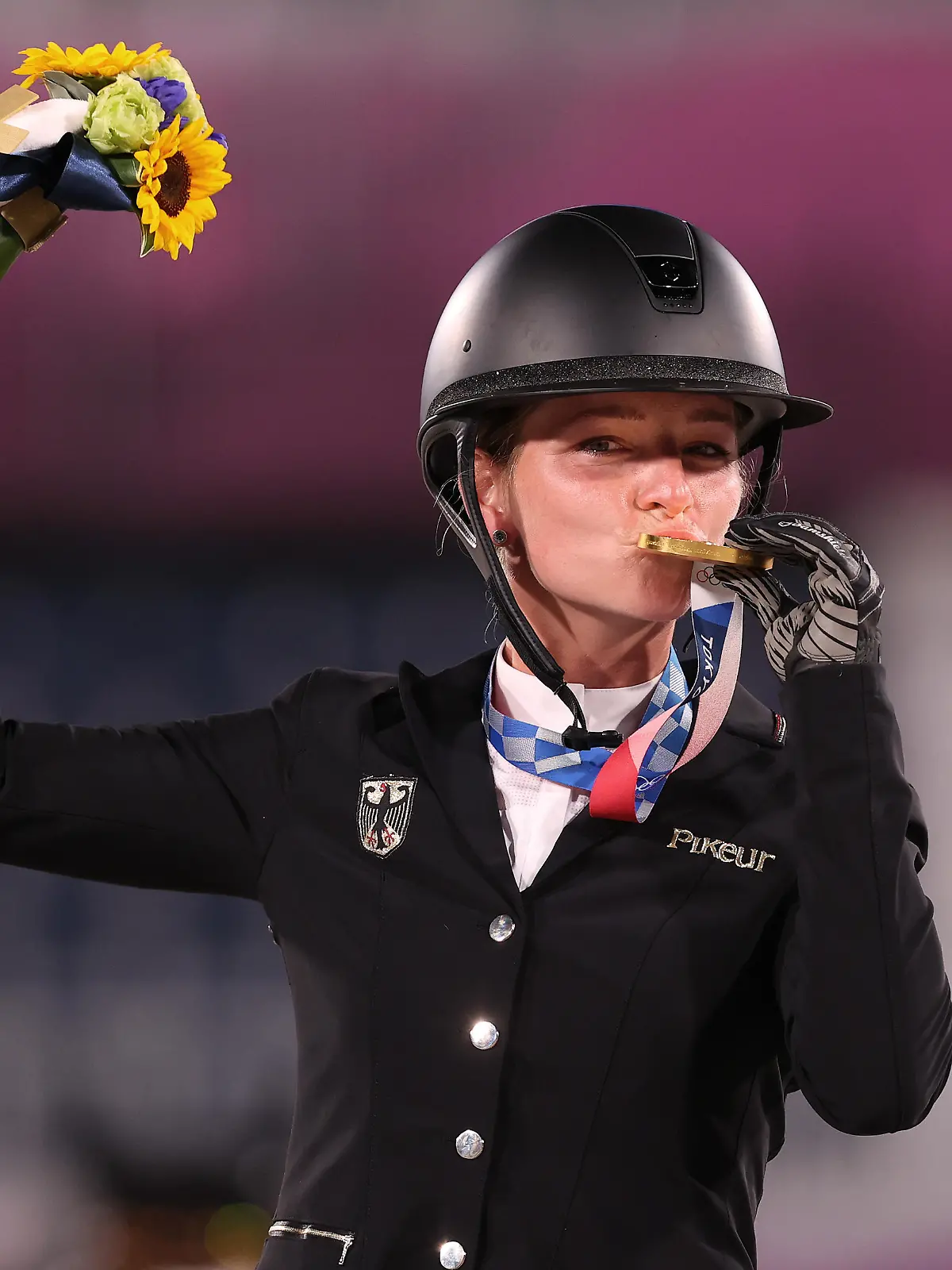 TOKYO, JAPAN - AUGUST 02: Gold medalist Julia Krajewski of Team Germany poses with the gold medal during the Eventing Individual Jumping medal ceremony on day ten of the Tokyo 2020 Olympic Games at Equestrian Park on August 02, 2021 in Tokyo, Japan. (Photo by Julian Finney/Getty Images)