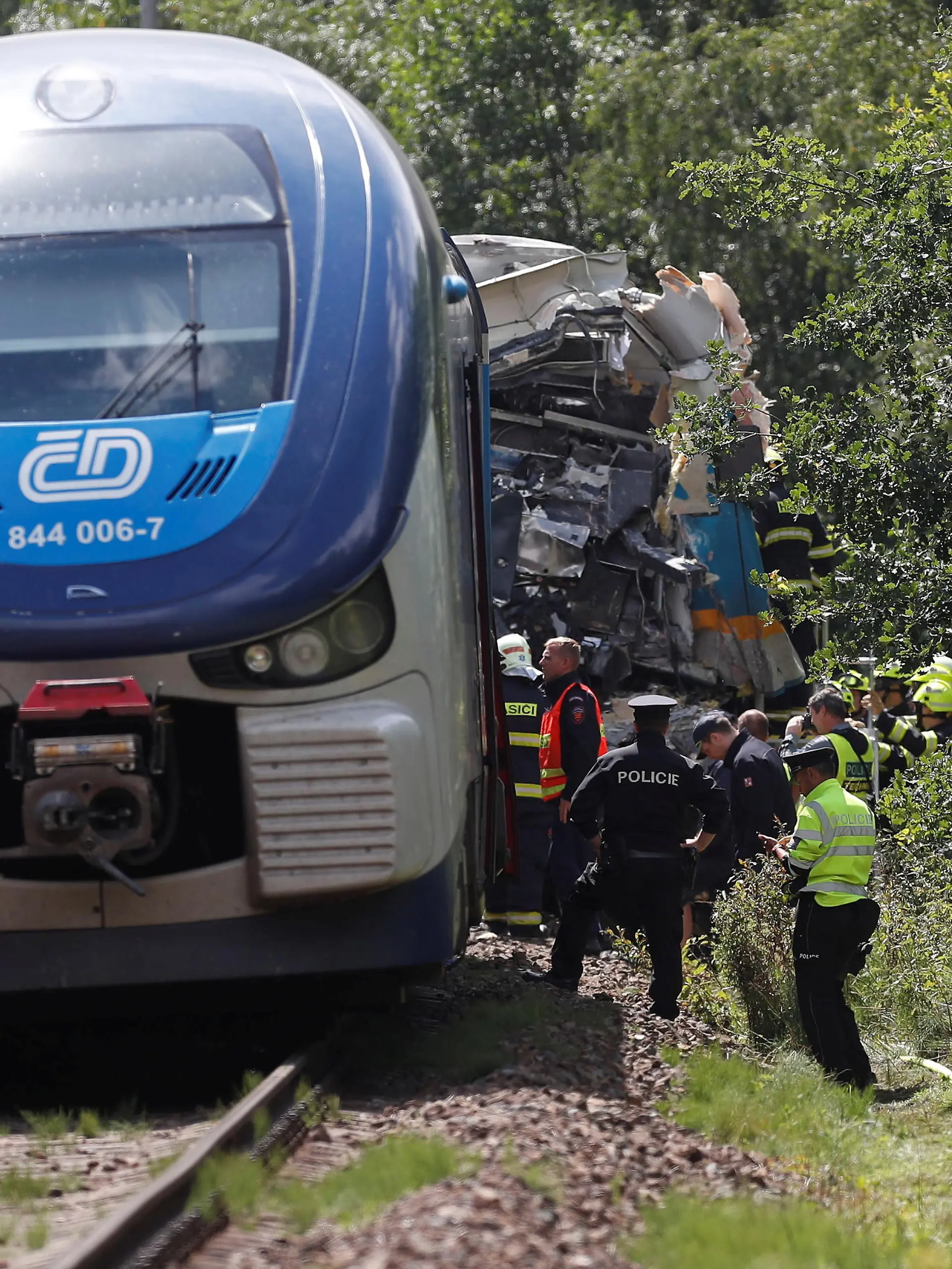 Emergency personnel work on a site of a train crash in a village of Milavce near the town of Domazlice, Czech Republic, August 4, 2021.   REUTERS/David W Cerny