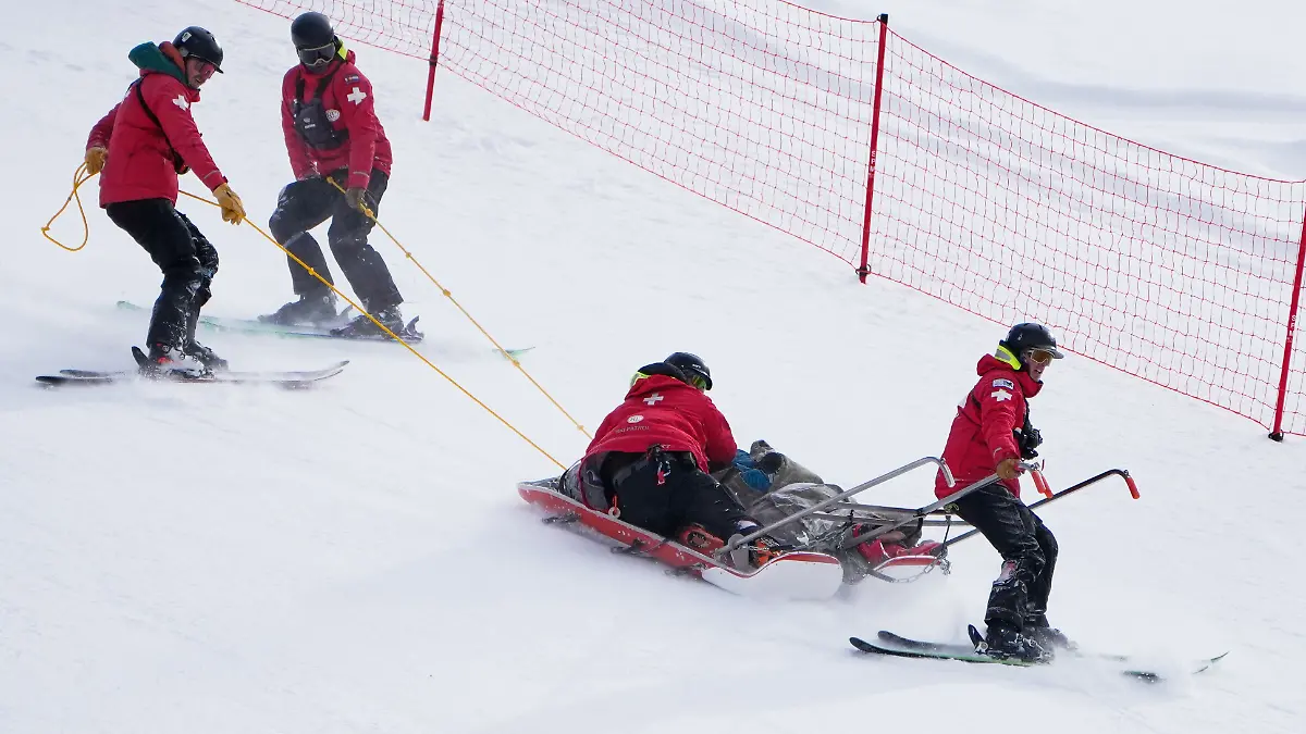 Ski patrol members bring down Slovenia’s Rok Elezi Aznoh after a crash will competing during a World Cup men’s downhill skiing race, Thursday, Dec. 4, 2025, in Beaver Creek, Colo. (AP Photo/John Locher)