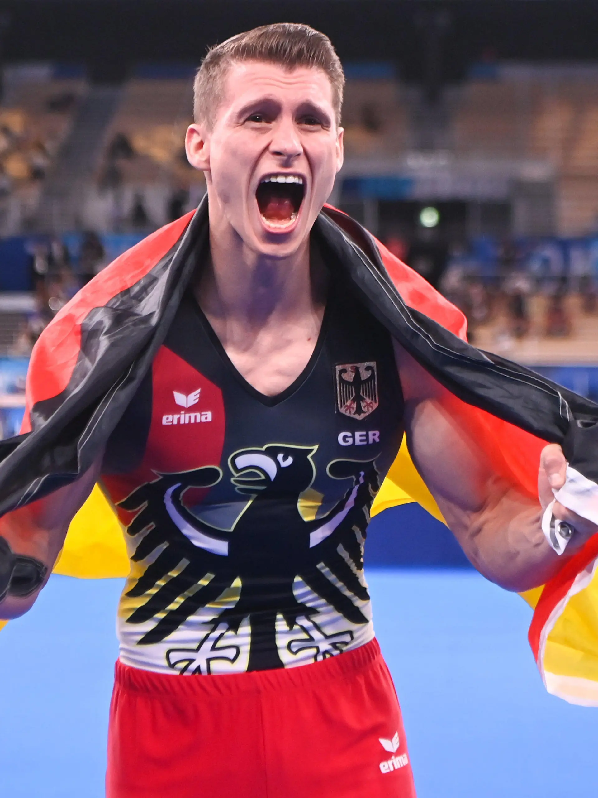 03.08.2021, Japan, Tokio: Turnen: Olympia, Barren, Männer, Finale im Ariake Gymnastics Centre. Lukas Dauser aus Deutschland freut sich über den zweiten Platz. Foto: Marijan Murat/dpa +++ dpa-Bildfunk +++