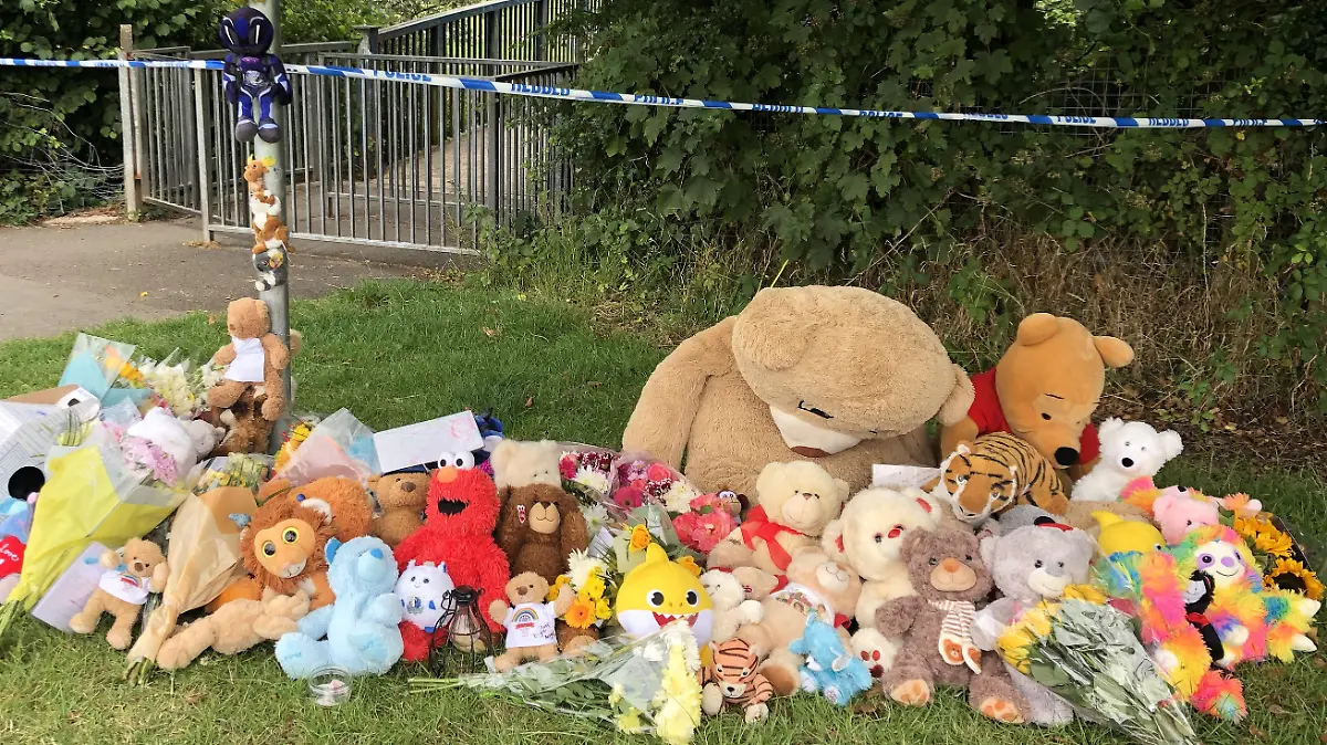 Boy found dead in river. Tributes left in Pandy Park in Bridgend, south Wales, near to where a five-year-old boy was found dead in the Ogmore River on Saturday. Picture date: Monday August 2, 2021. A 39-year-old man, a 30-year-old woman and a 13-year-old boy, all from the Bridgend area, have been arrested on suspicion of murder. See PA story POLICE Bridgend. Photo credit should read: Claire Hayhurst/PA Wire URN:61376820