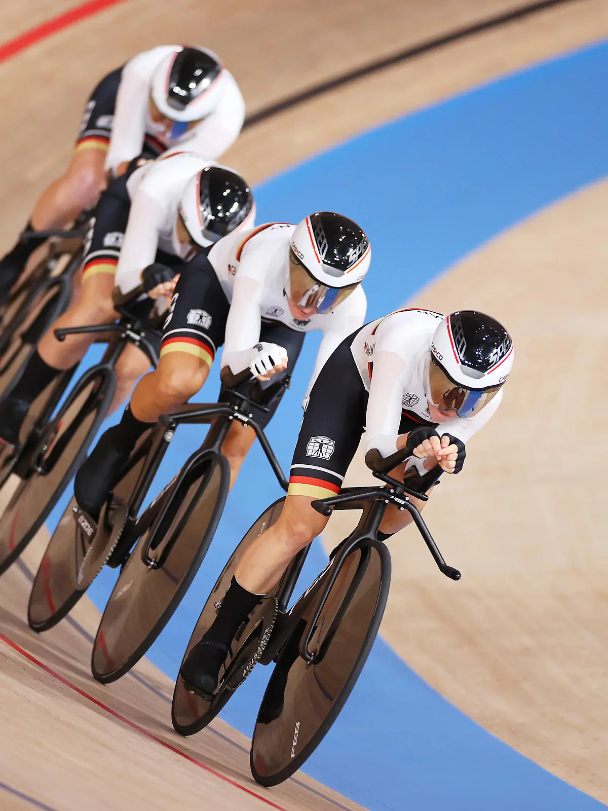 IZU, JAPAN - AUGUST 03: Franziska Brausse, Lisa Brennauer, Lisa Klein and Mieke Kroeger of Team Germany sprint to setting a new Olympic record during the Women's team pursuit first round, heat 4 of the Track Cycling on day eleven of the Tokyo 2020 Olympic Games at Izu Velodrome on August 03, 2021 in Izu, Japan. (Photo by Justin Setterfield/Getty Images)