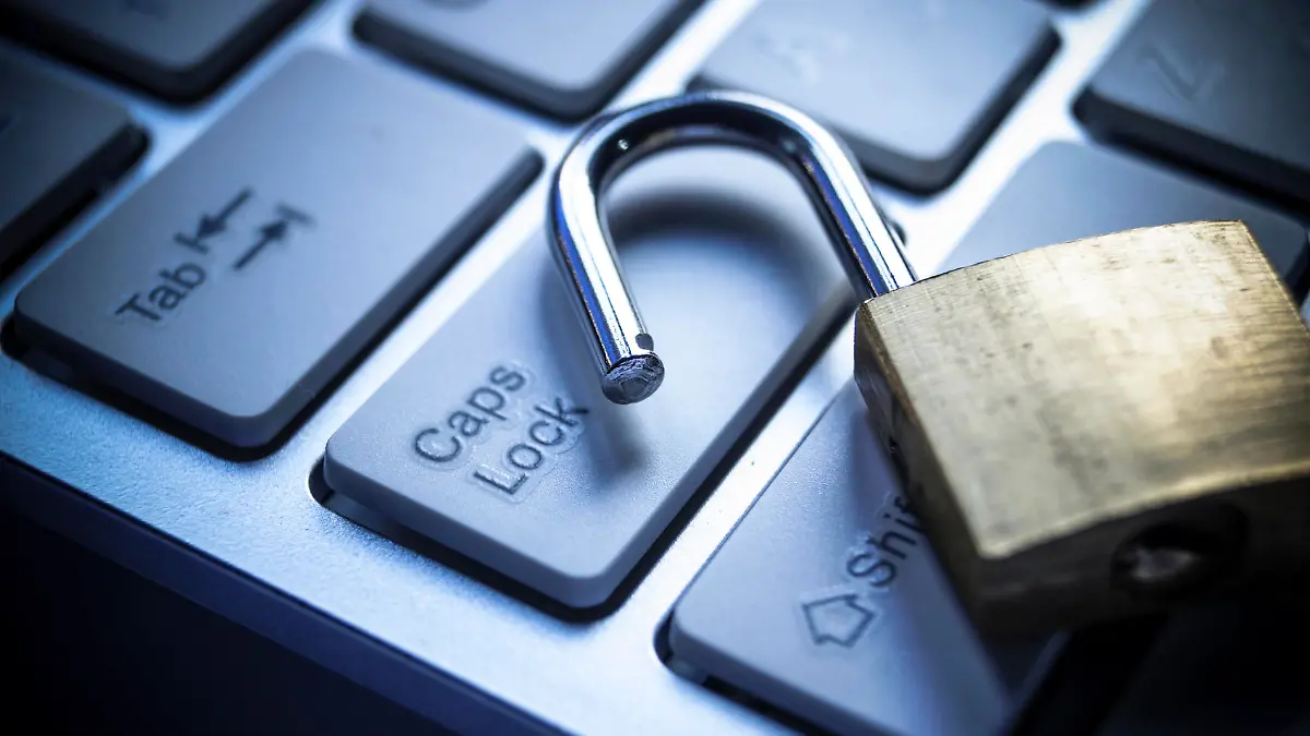 open security lock on computer keyboard - computer security breach concept