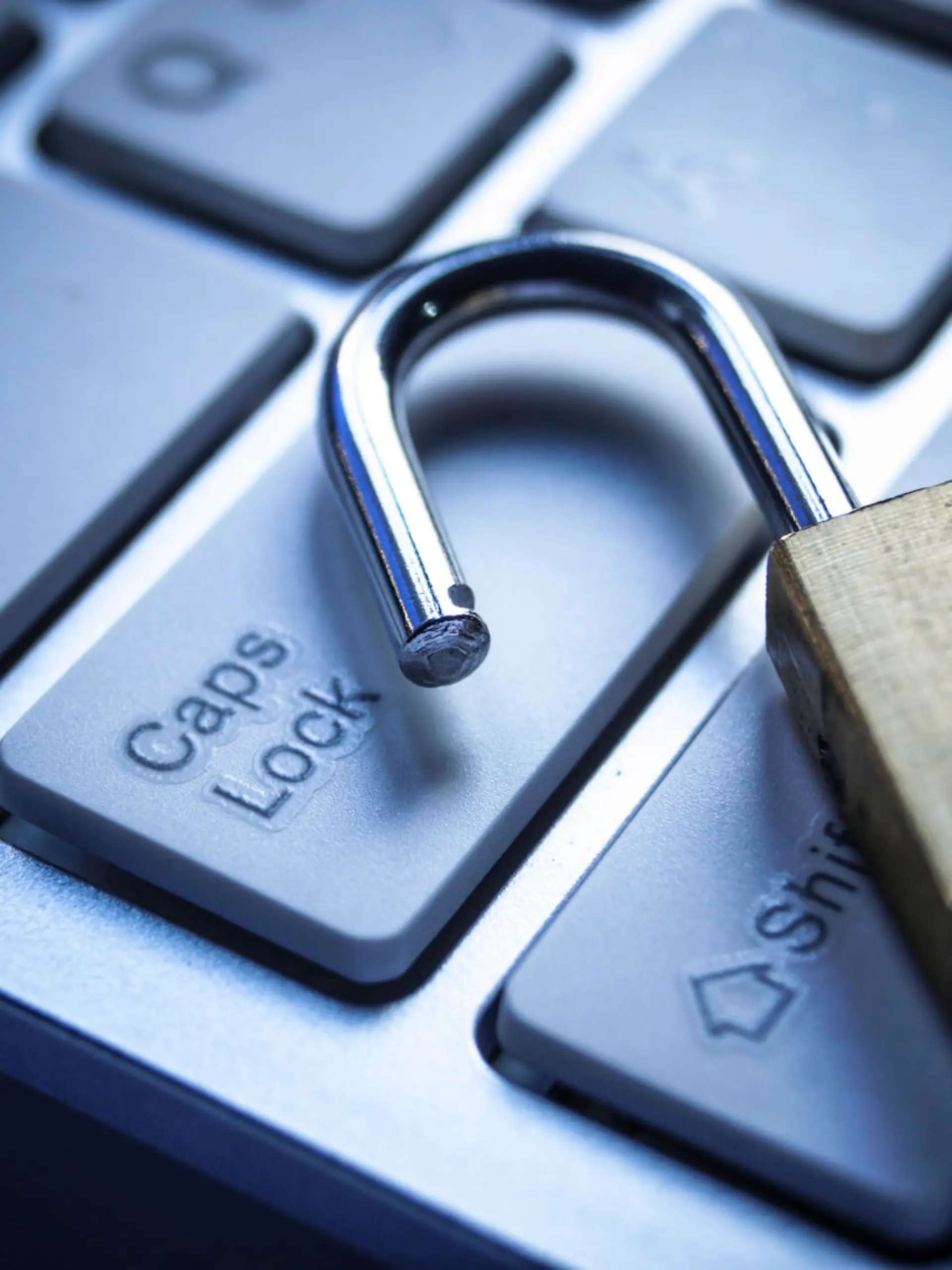 open security lock on computer keyboard - computer security breach concept