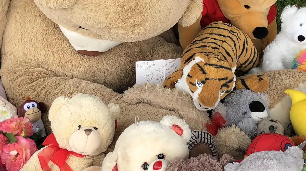 Boy found dead in river. Tributes left in Pandy Park in Bridgend, south Wales, near to where a five-year-old boy was found dead in the Ogmore River on Saturday. Picture date: Monday August 2, 2021. A 39-year-old man, a 30-year-old woman and a 13-year-old boy, all from the Bridgend area, have been arrested on suspicion of murder. See PA story POLICE Bridgend. Photo credit should read: Claire Hayhurst/PA Wire URN:61376815