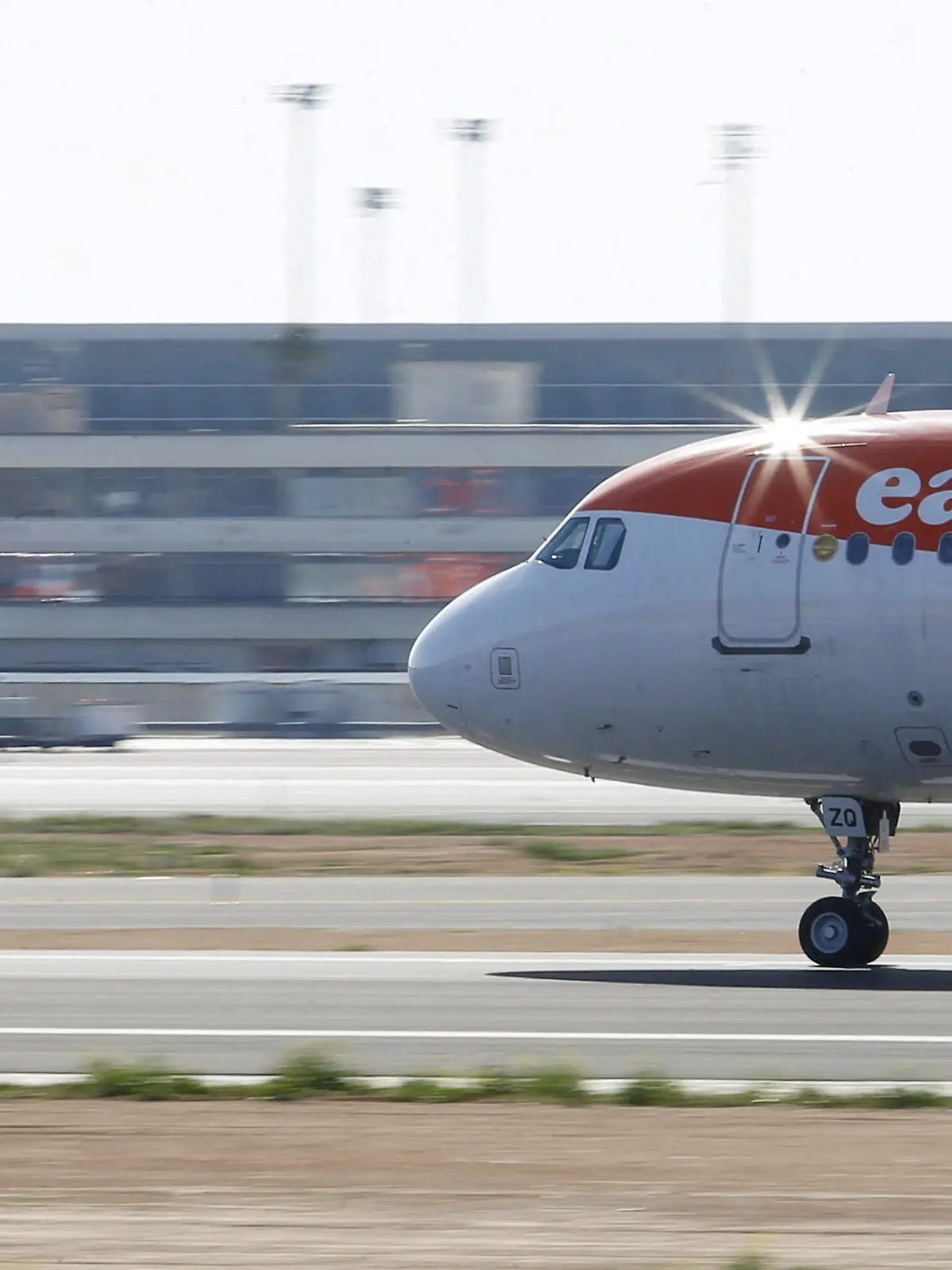 FILE PHOTO: EasyJet airliner lands at Son Sant Joan airport in Palma de Mallorca