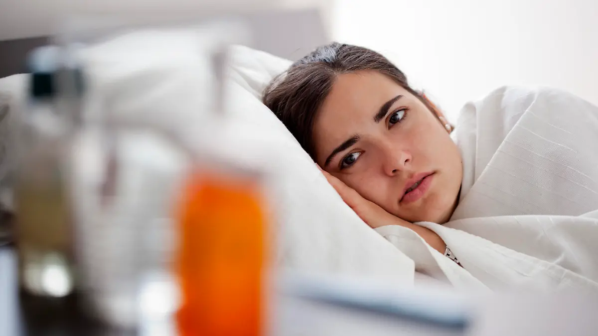 Young woman who feeling sick at home.