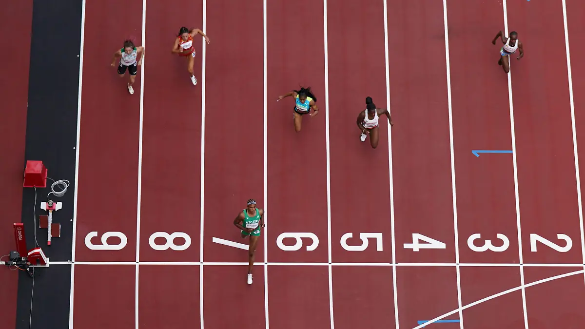 Tokyo 2020 Olympics - Athletics - Women's 100m - Round 1 - OLS - Olympic Stadium, Tokyo, Japan - July 30, 2021. Blessing Okagbare of Nigeria crosses the line to win Heat 6 REUTERS/Pawel Kopczynski