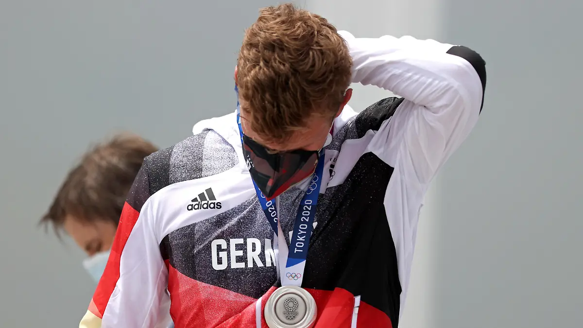TOKYO, JAPAN - JULY 30: Silver medalist Hannes Ocik of Team Germany reacts following the medal ceremony for the Men's Eight Final A on day seven of the Tokyo 2020 Olympic Games at Sea Forest Waterway on July 30, 2021 in Tokyo, Japan. (Photo by Naomi Baker/Getty Images)