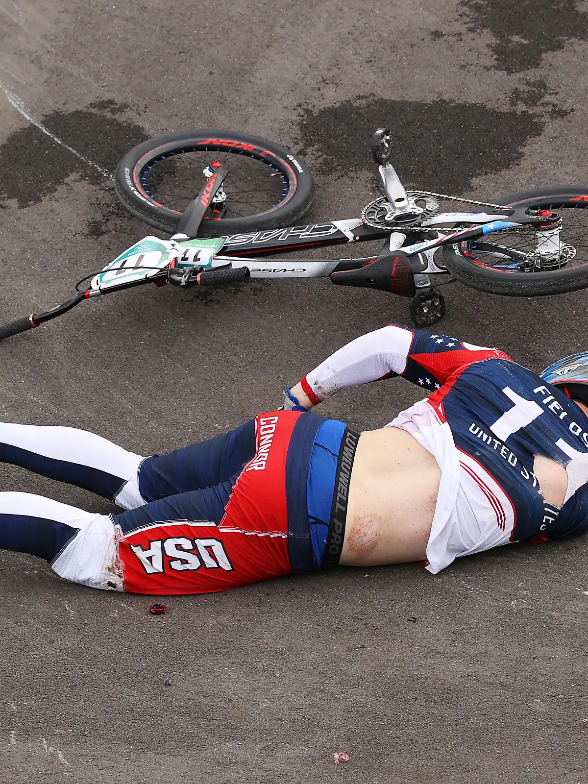 TOKYO, JAPAN - JULY 30: Connor Fields of Team United States goes down holding his hip after a crash during the Men's BMX semifinal heat 1, run 3 on day seven of the Tokyo 2020 Olympic Games at Ariake Urban Sports Park on July 30, 2021 in Tokyo, Japan. (Photo by Francois Nel/Getty Images)