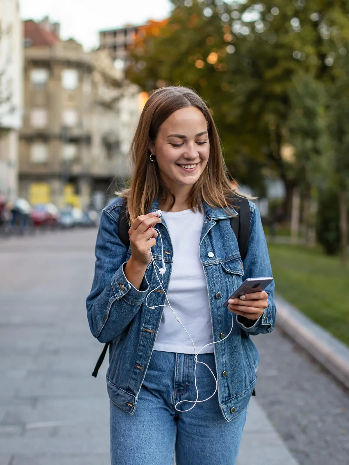 Photo of young woman enjoying in the city