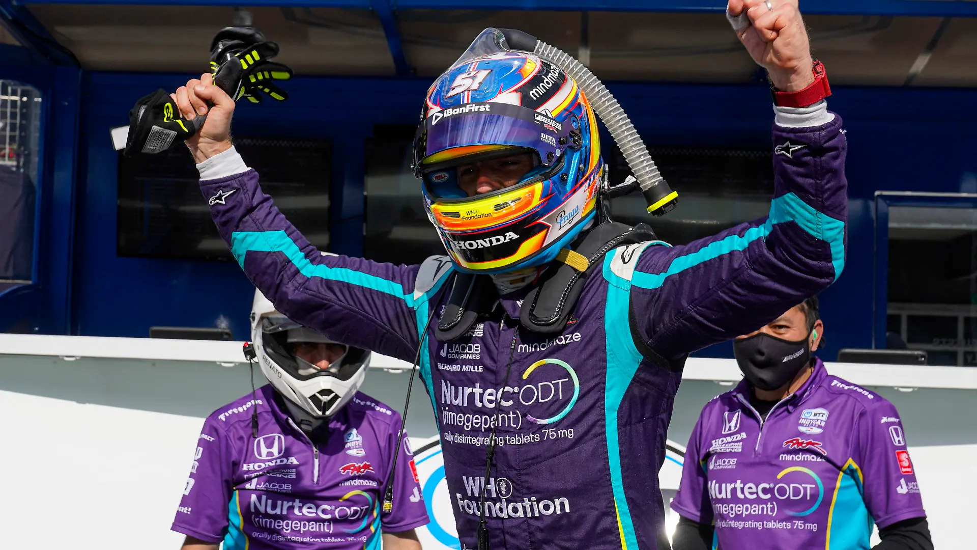 Romain Grosjean, of Switzerland, celebrates after winning the pole during qualifications for the IndyCar auto race at Indianapolis Motor Speedway in Indianapolis, Friday, May 14, 2021. (AP Photo/Michael Conroy)