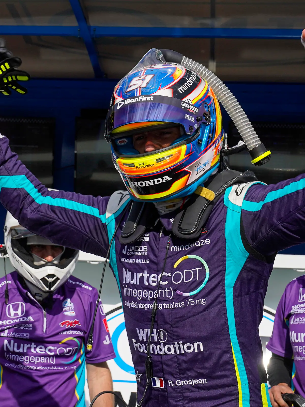 Romain Grosjean, of Switzerland, celebrates after winning the pole during qualifications for the IndyCar auto race at Indianapolis Motor Speedway in Indianapolis, Friday, May 14, 2021. (AP Photo/Michael Conroy)