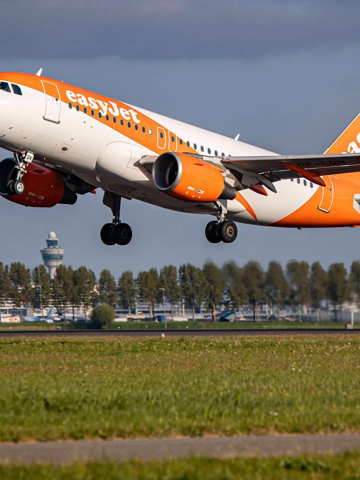 EasyJet Europe Airbus A319 Departs From Amsterdam EasyJet Europe Airbus A319 aircraft as seen during taxiing, rotate an