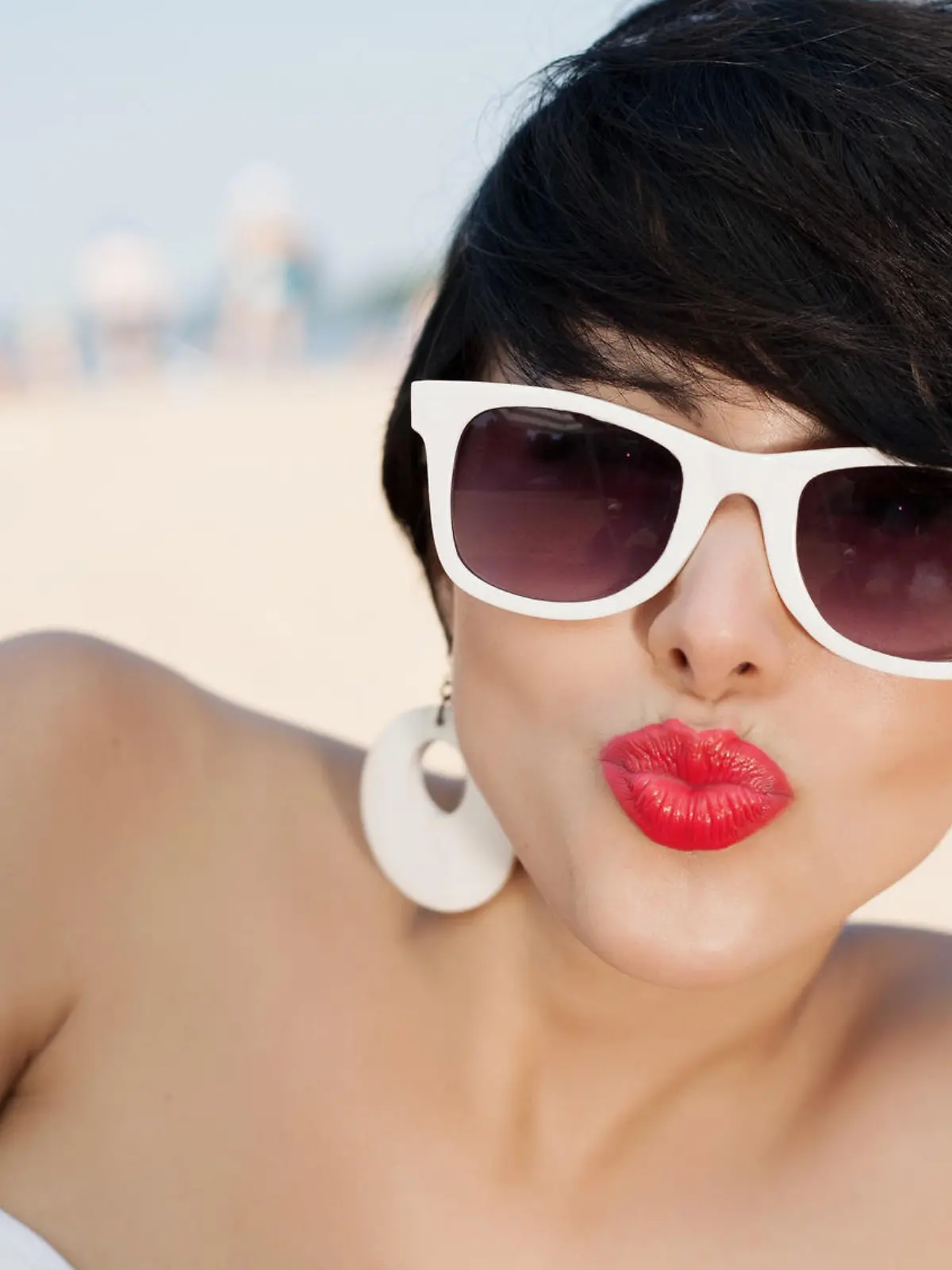 Beautiful sexy woman relaxing on the beach - outdoors